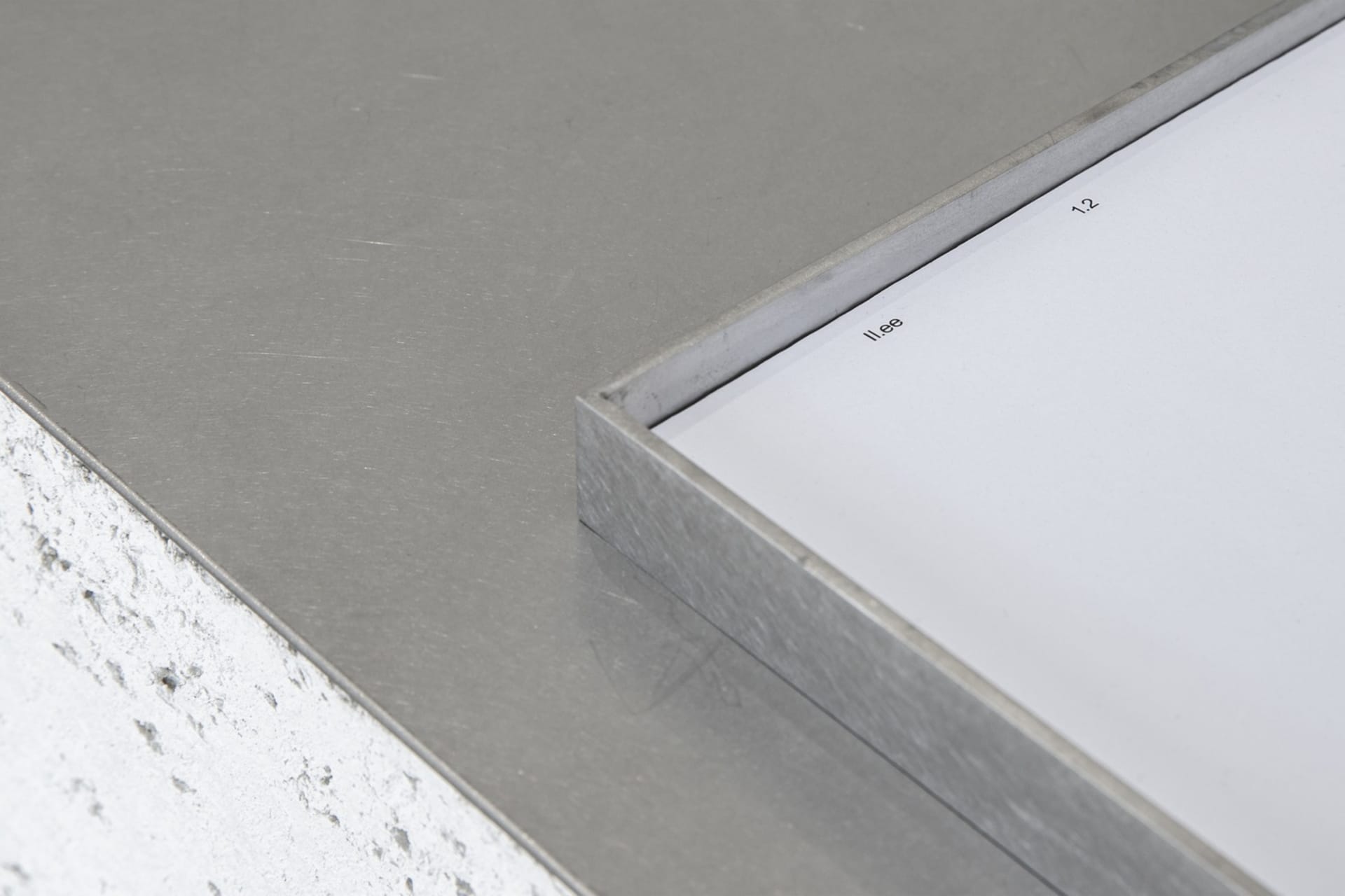 Gray metal surface with a modern industrial look, possibly part of an interior design project