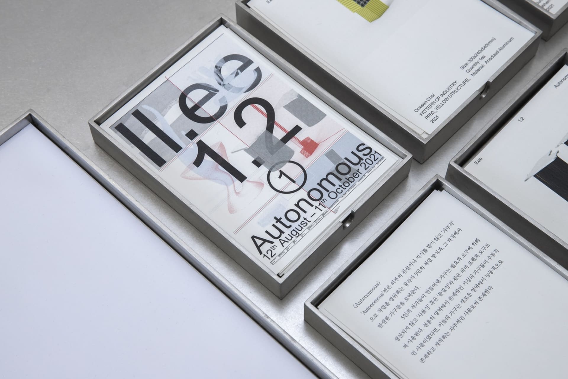 A table display of three main books and two smaller books, arranged in an organized and visually appealing manner