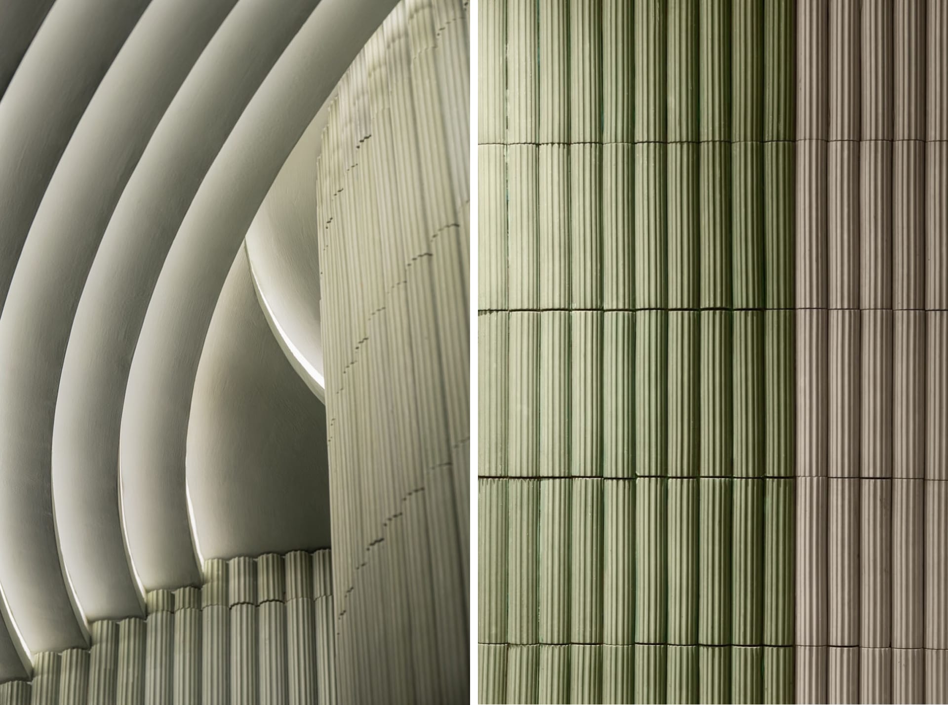 A concrete building with a green tile exterior, featuring a mix of modern and neutral architectural elements