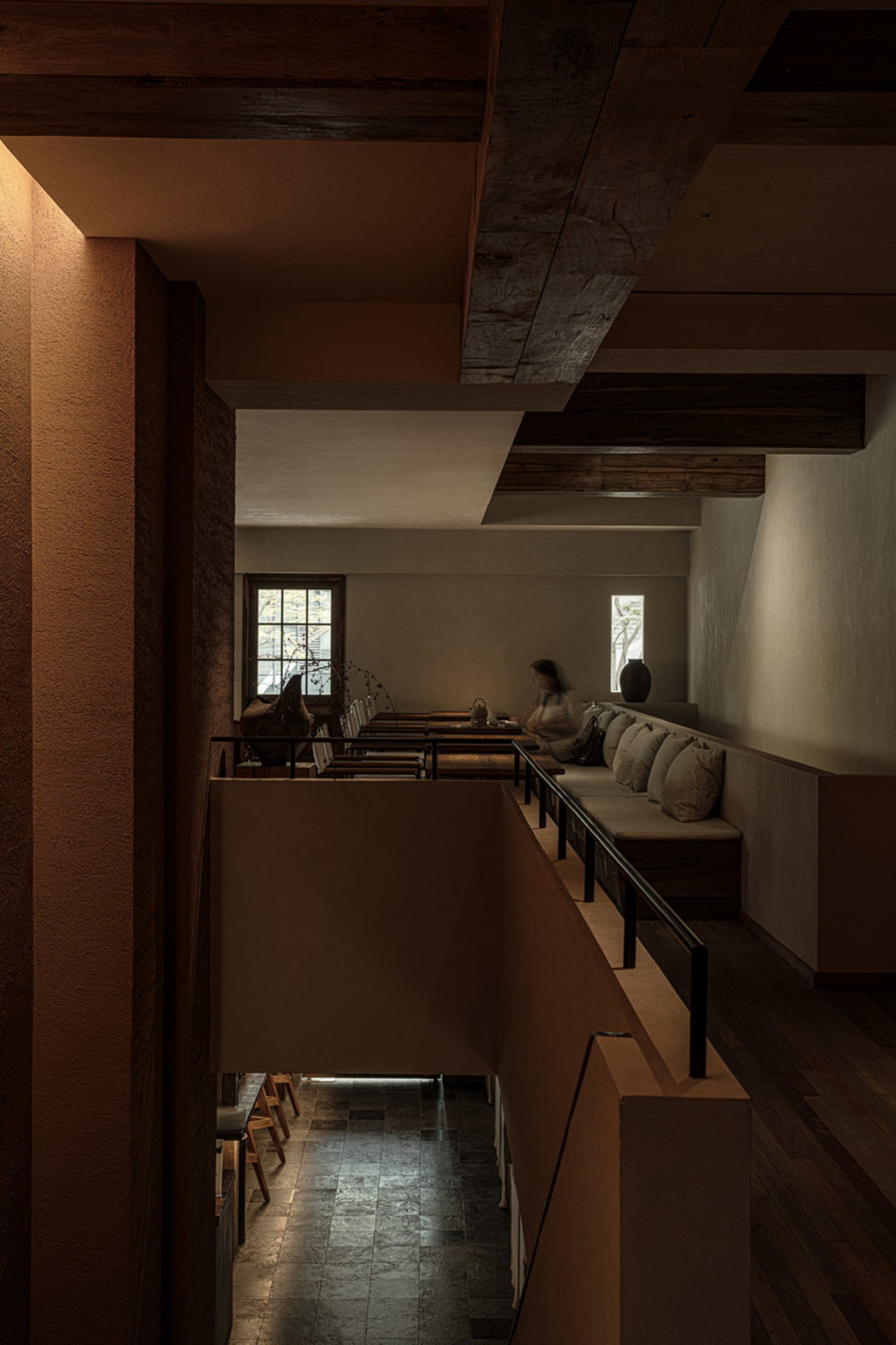 A cozy living area with two couches, chairs, and a dining table, creating a warm and inviting atmosphere for relaxation and socializing