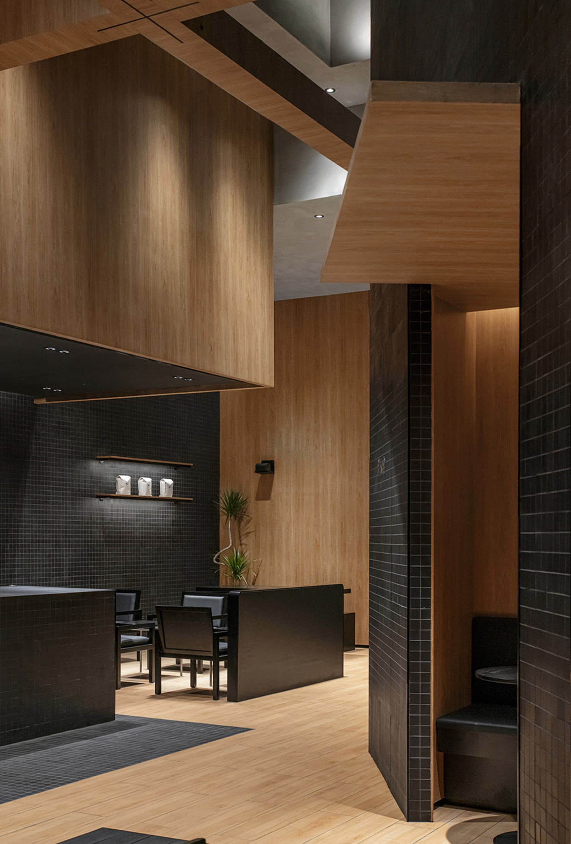 Warm and inviting restaurant interior with wooden walls and floors, featuring chairs and dining tables