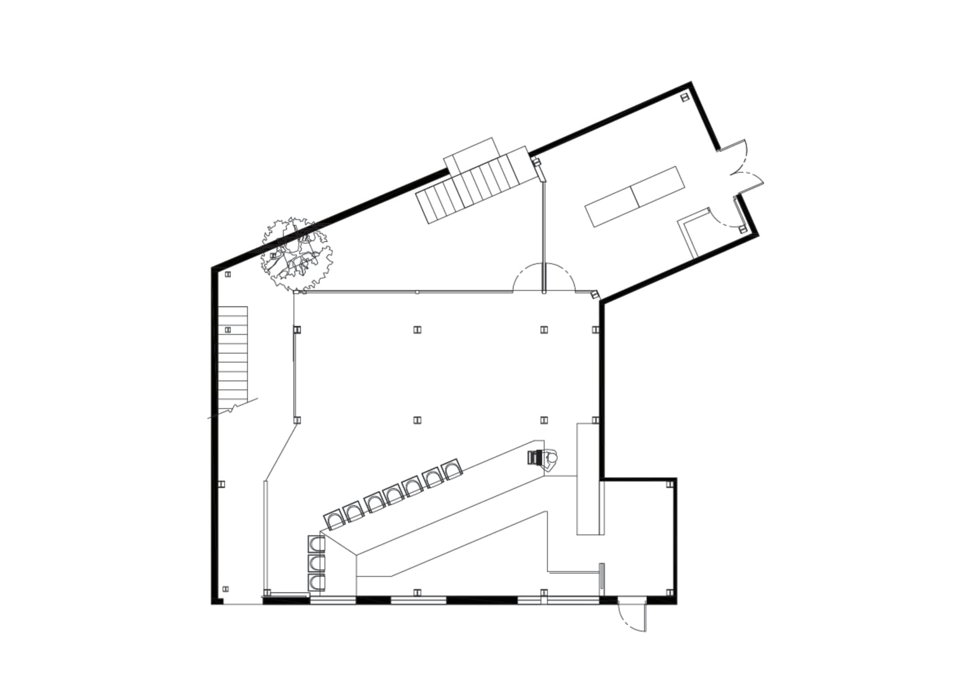 2D floor plan of a modern office space with a staircase, chairs, and clean lines