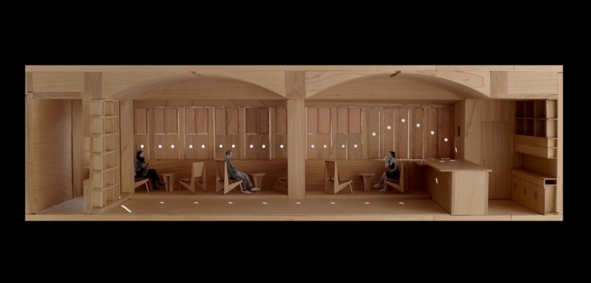 A warm and inviting living space with wooden walls and floors, featuring chairs and two people in a rendered scene