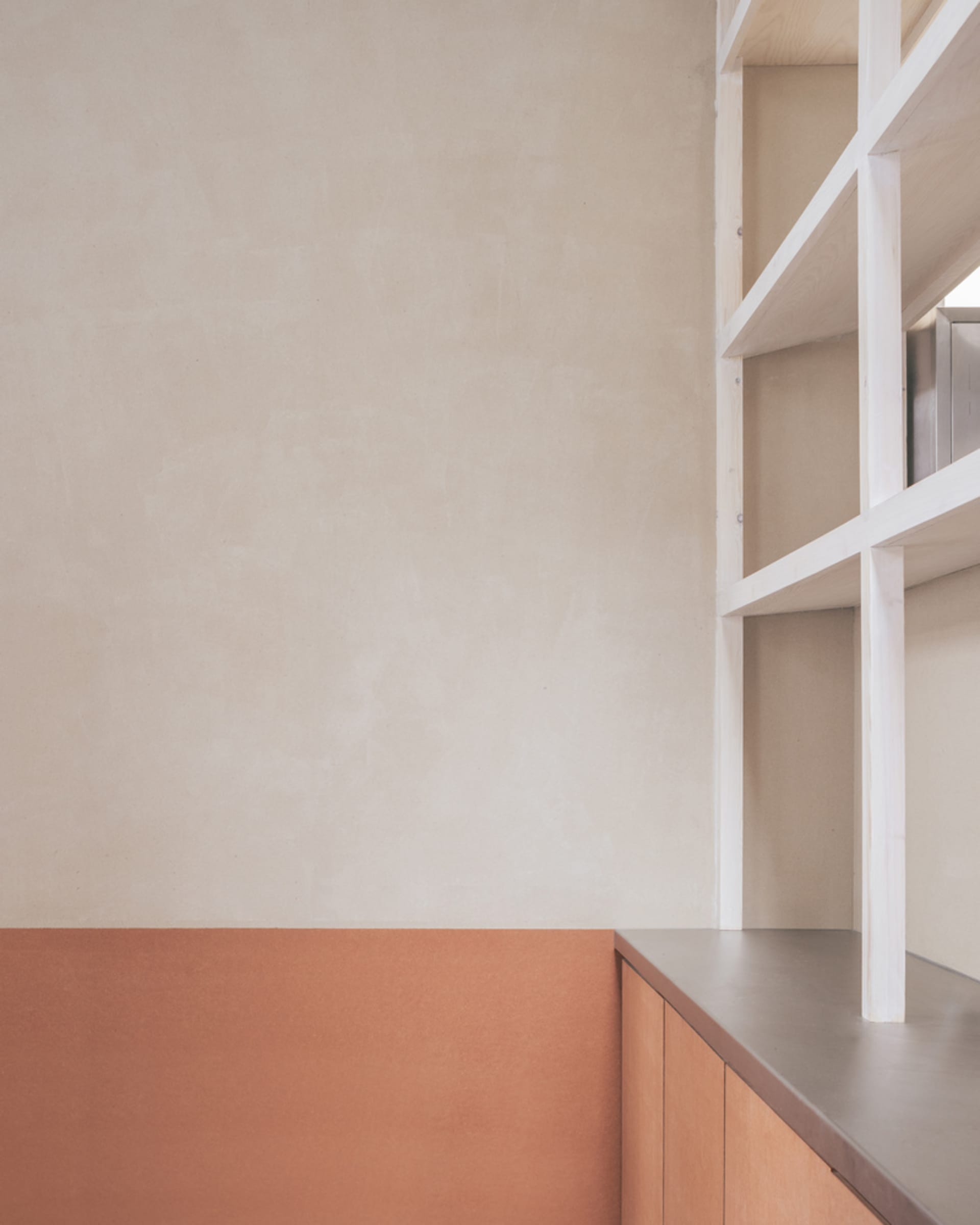 A warm and inviting kitchen scene with a wooden countertop, wooden cabinet, and two books placed on the countertop