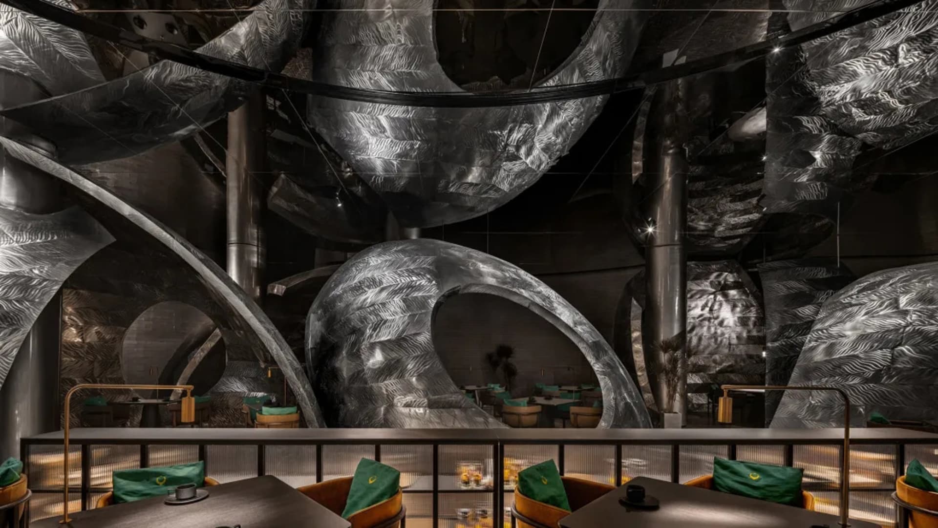 Modern restaurant interior with a spiral metal staircase, contemporary design, and stylish atmosphere