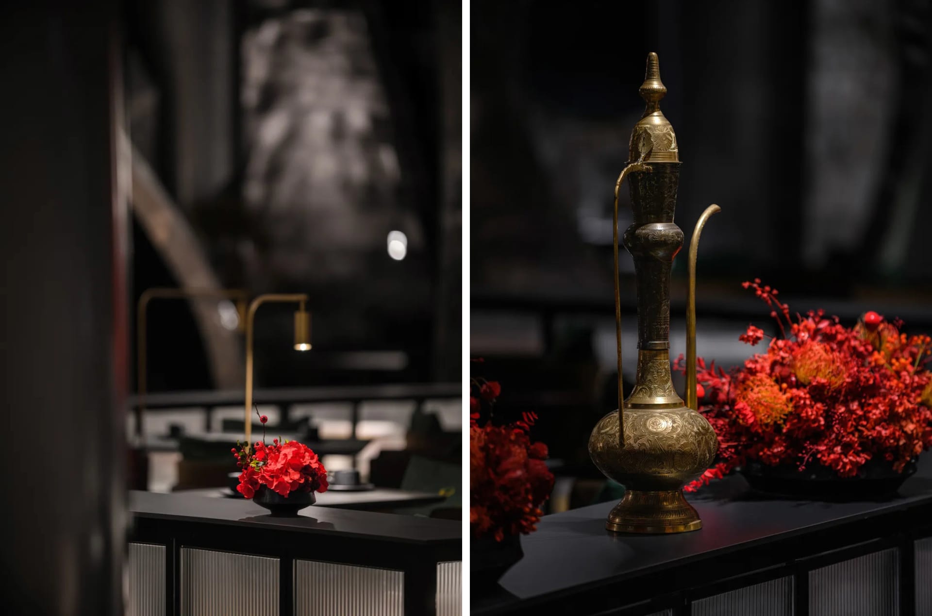 A warm and inviting dining space with a wooden table, gold accents, and decorative elements, featuring a vase with red flowers on a black table in the foreground and a well-designed dining area in the background