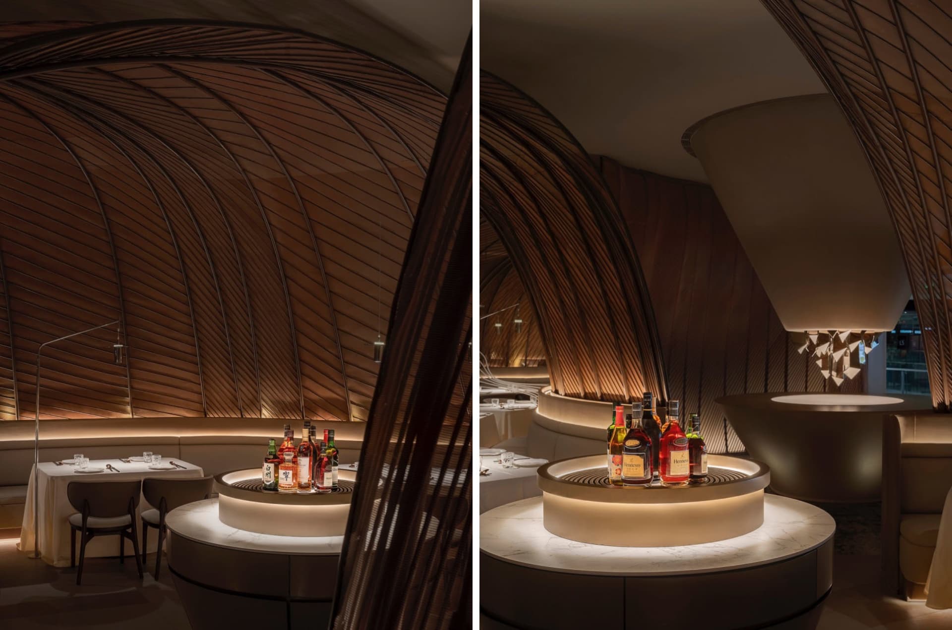 A warm and inviting bar area with wooden bar counter and multiple bottles on the table, creating a cozy atmosphere for guests to enjoy their drinks