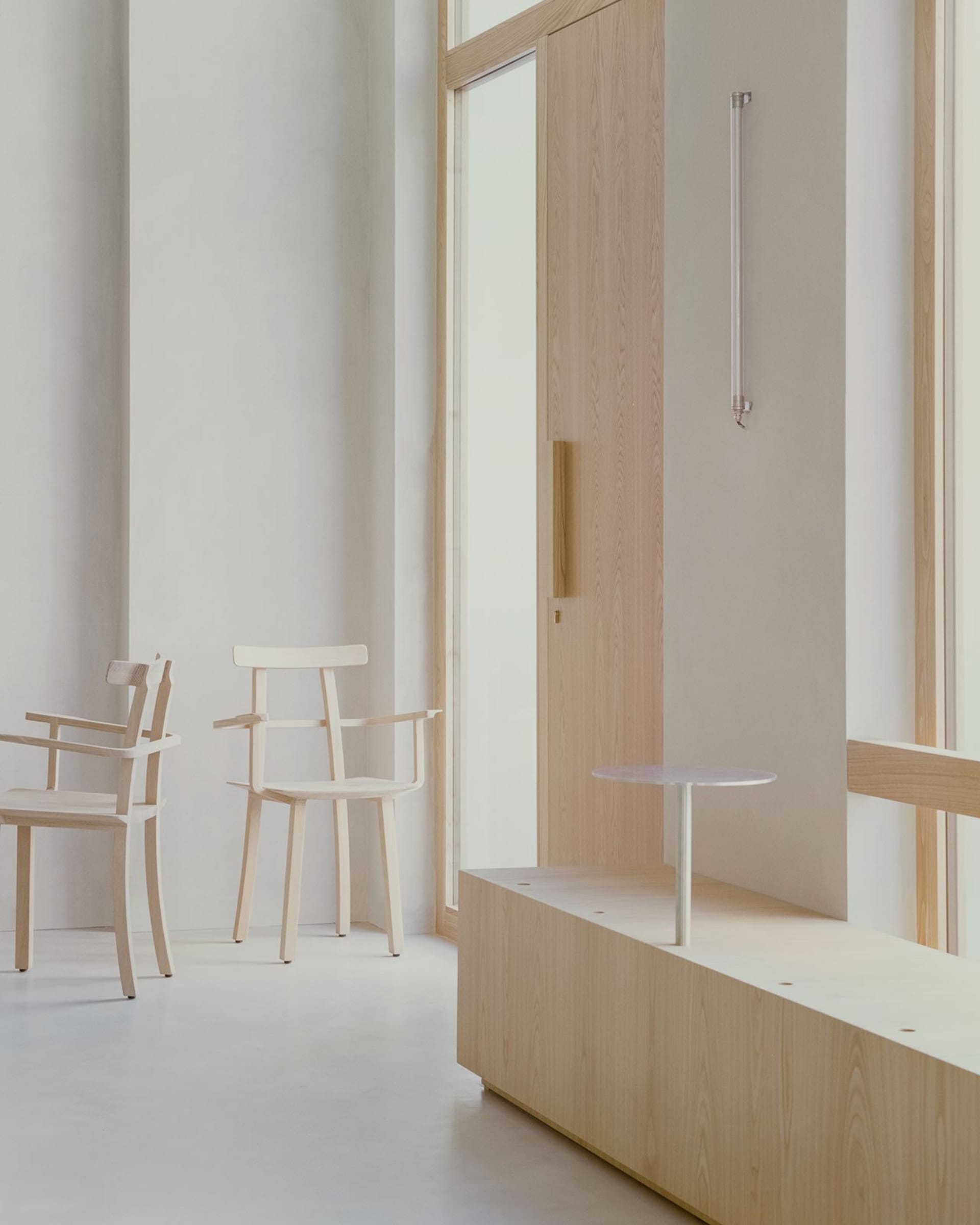 An inviting room with four wooden chairs and a small table, ideal for socializing or relaxation