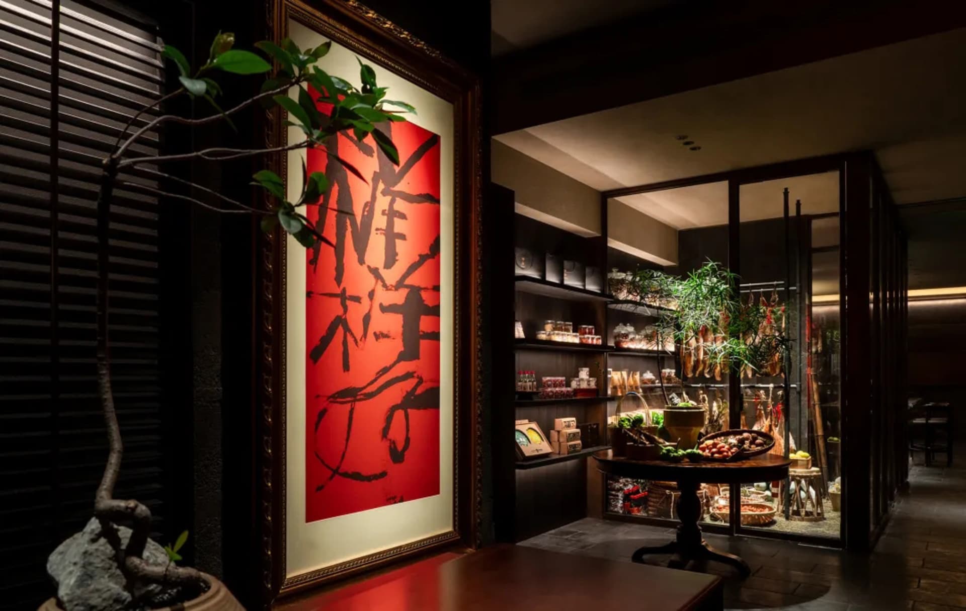 A bustling Asian restaurant with a red Chinese character painting on the wall, surrounded by bowls and bottles, suggesting a variety of traditional dishes and ingredients