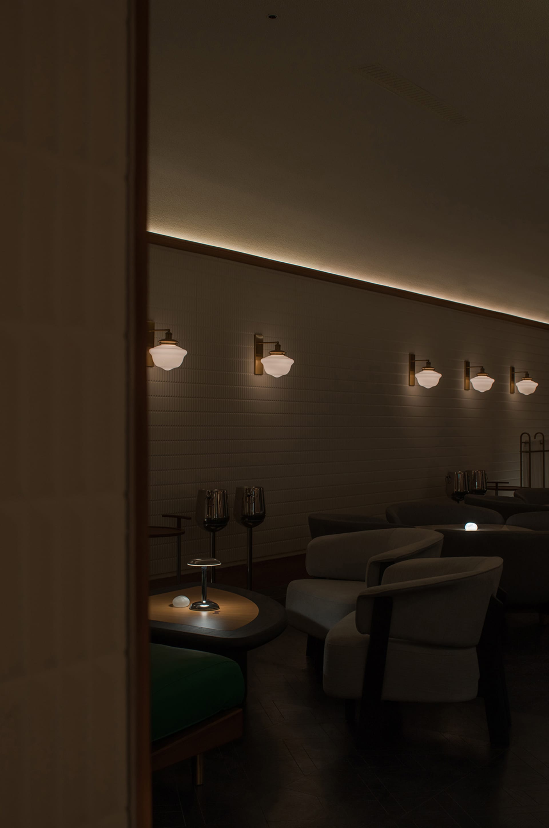 A modern cafe with a large dining area featuring brick walls, multiple chairs, and tables, with clean lines and minimalistic decoration
