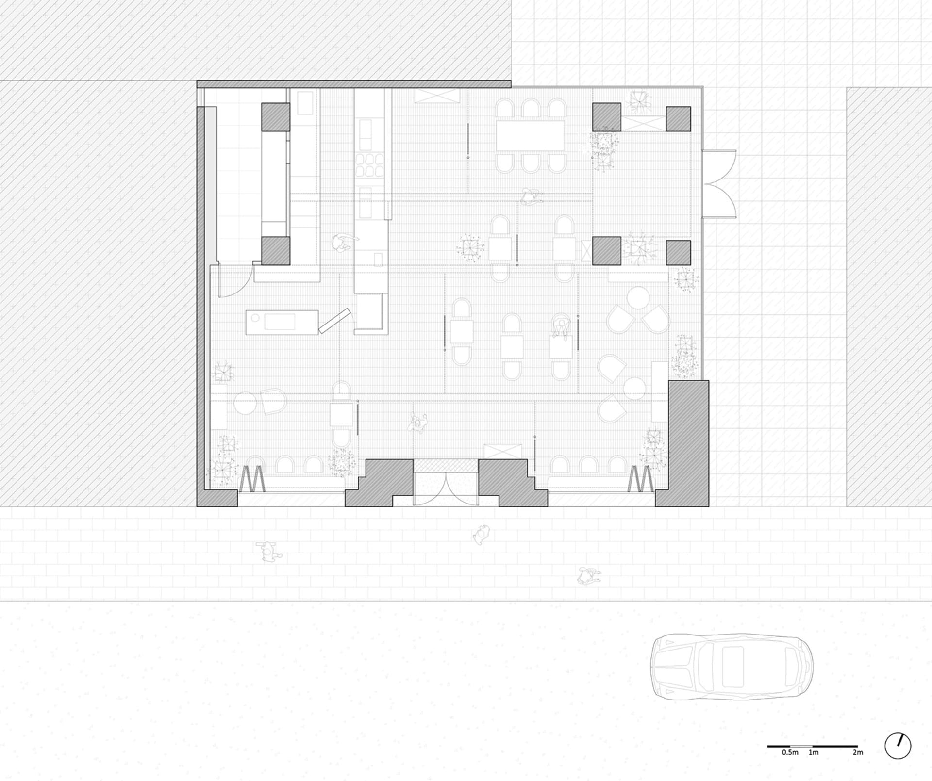 Architectural drawing of a large open office space with multiple rooms, hallways, chairs, and a car in the lower part of the drawing