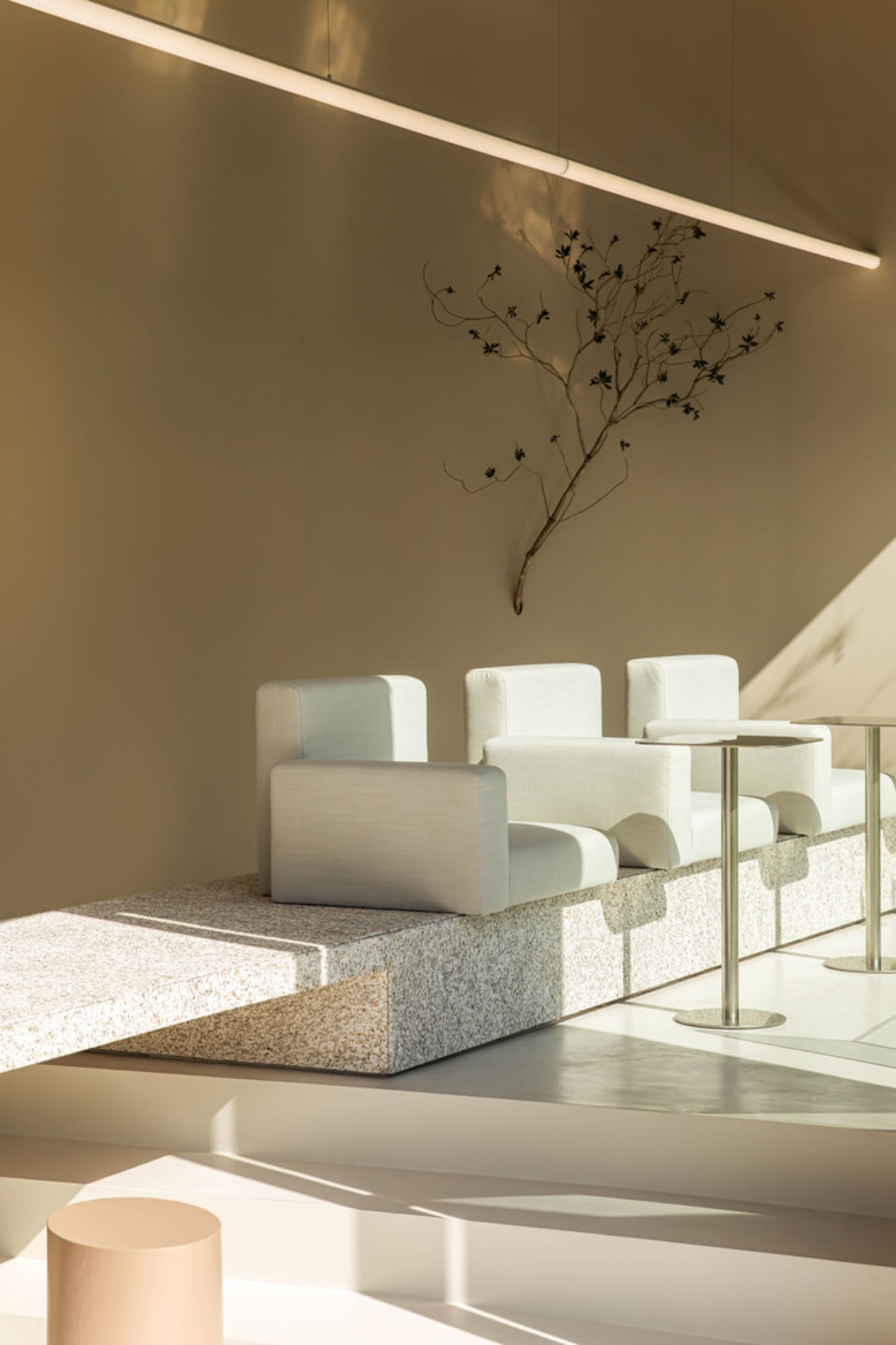 A modern and minimalist interior design concept featuring multiple chairs in a clean and organized space with bright and inviting lighting