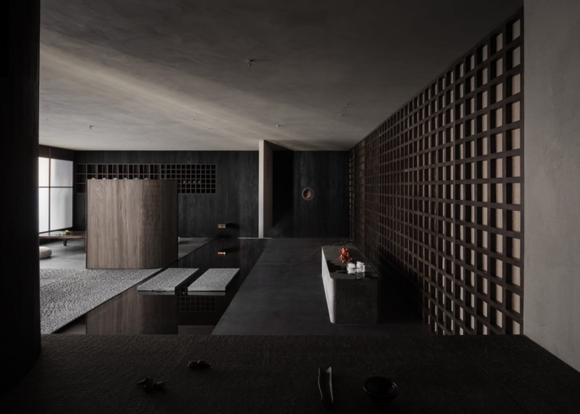 Empty modern kitchen with a dark atmosphere, featuring a sink surrounded by decorative vases and kitchenware