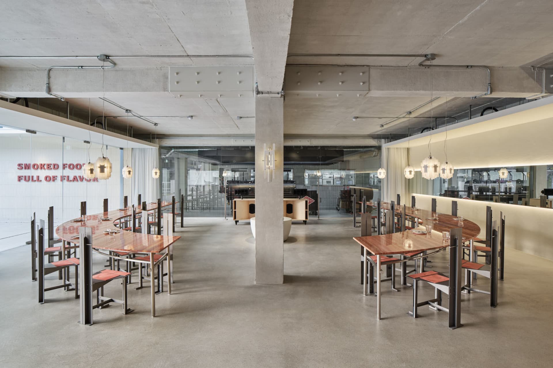 Industrial restaurant with multiple dining tables and chairs, modern and functional design for efficient space use