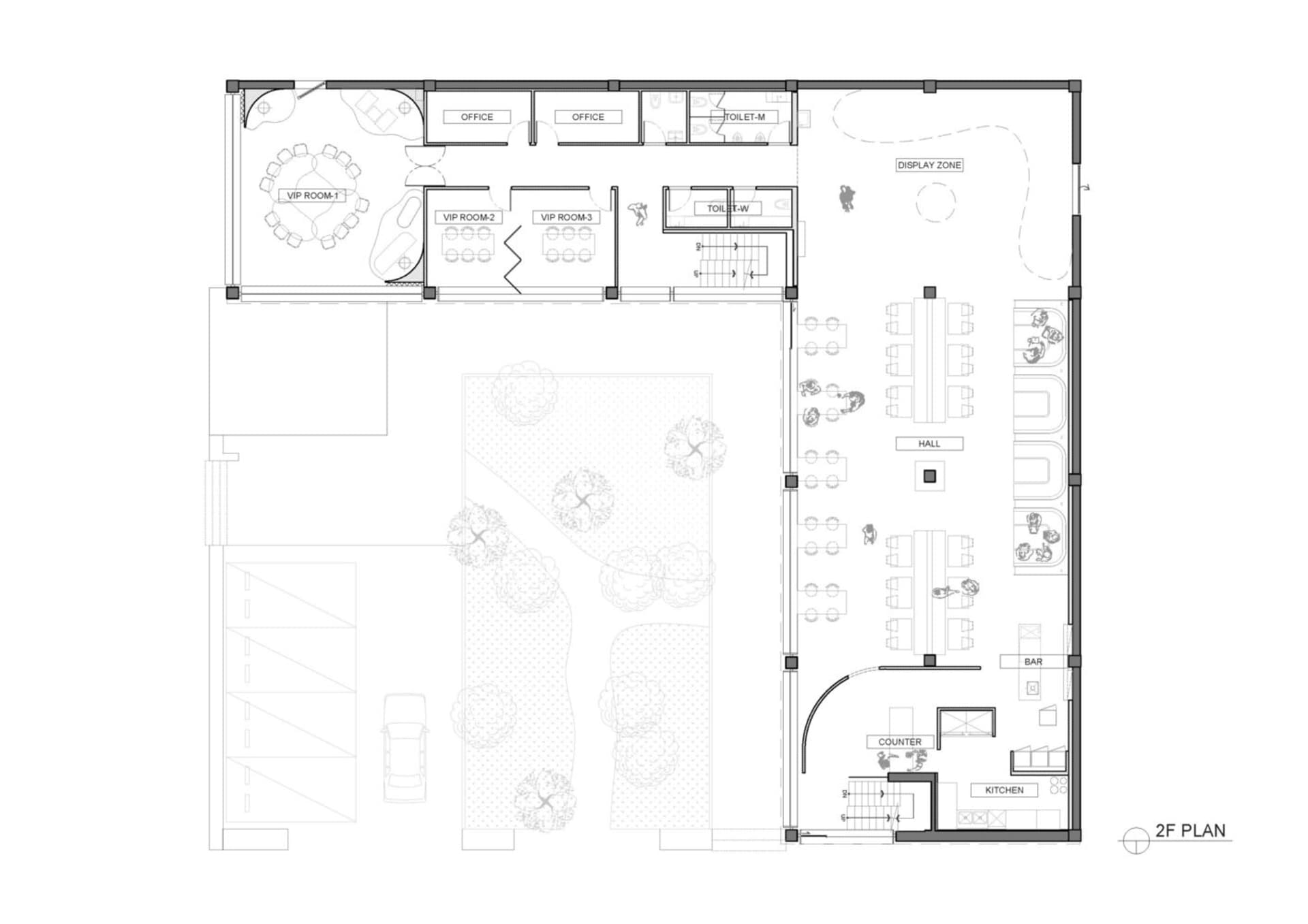 An empty white building with chairs and dining tables in a spacious communal area