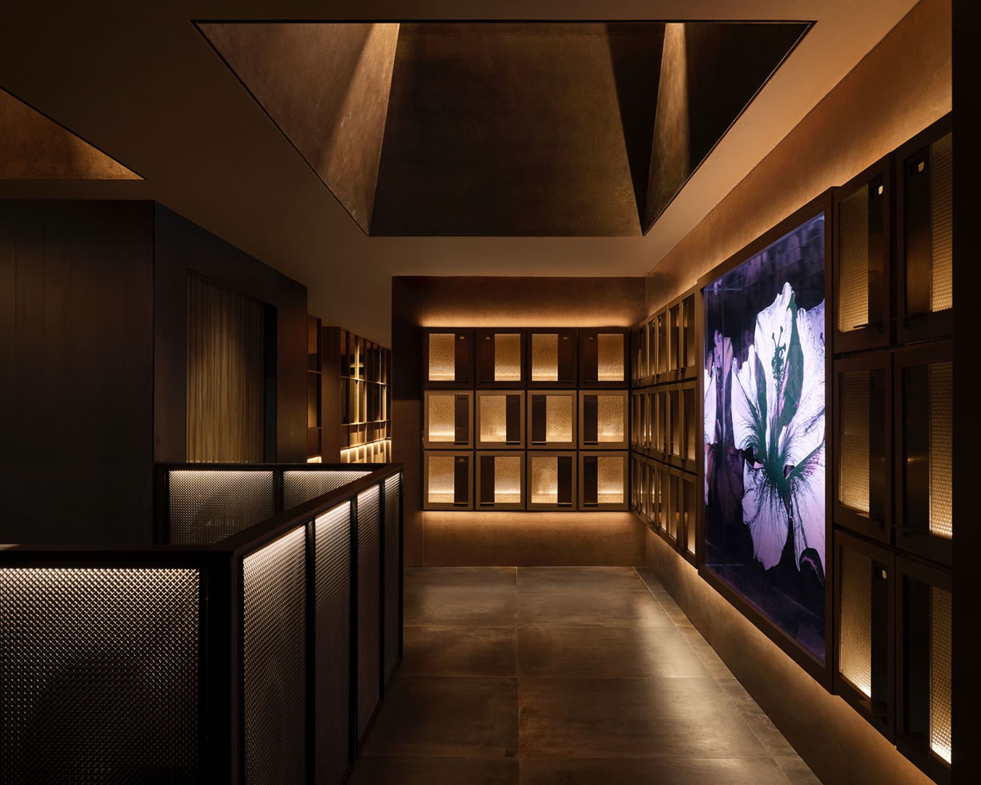 Elegant interior design showroom with a variety of artwork on the walls, well-lit and sophisticated atmosphere