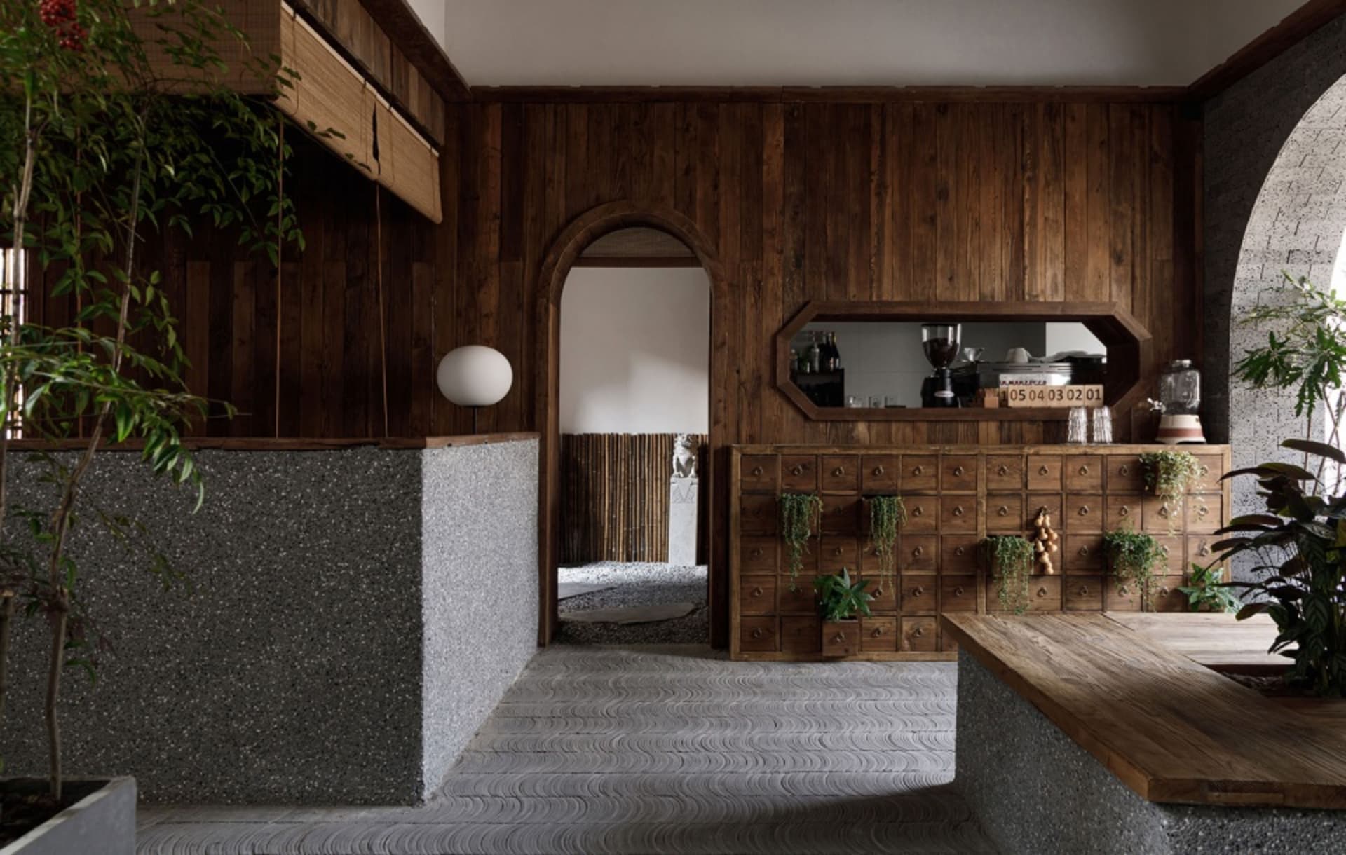 Cozy kitchen with wooden furniture, potted plants, and a dining table, surrounded by warm and inviting atmosphere