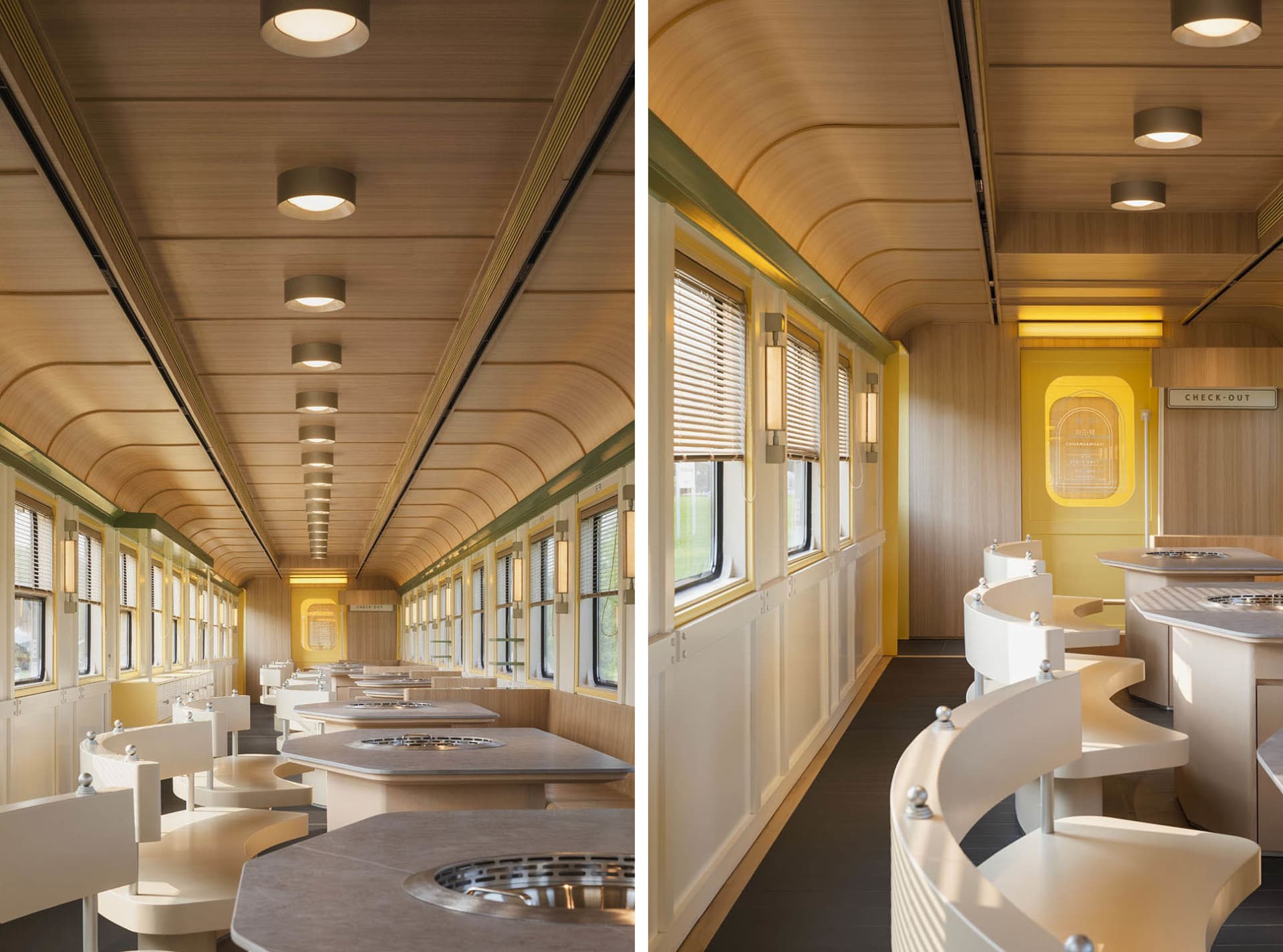 Modern train car dining area with multiple tables and chairs, decorative items, and a comfortable atmosphere