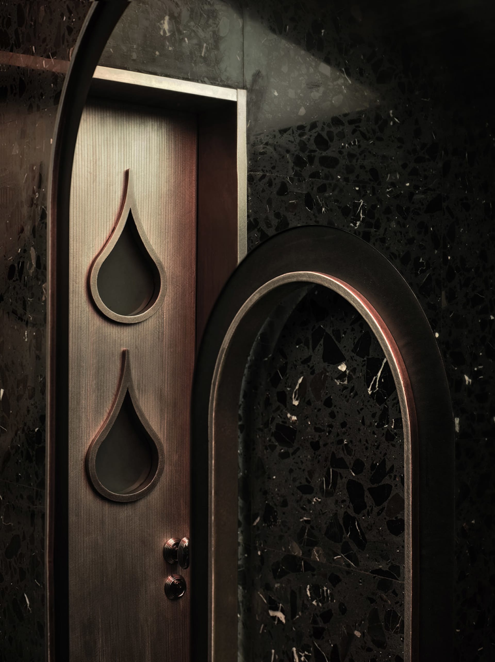 Ornate wooden doors with carved designs and water drops, set in a traditional architectural style building