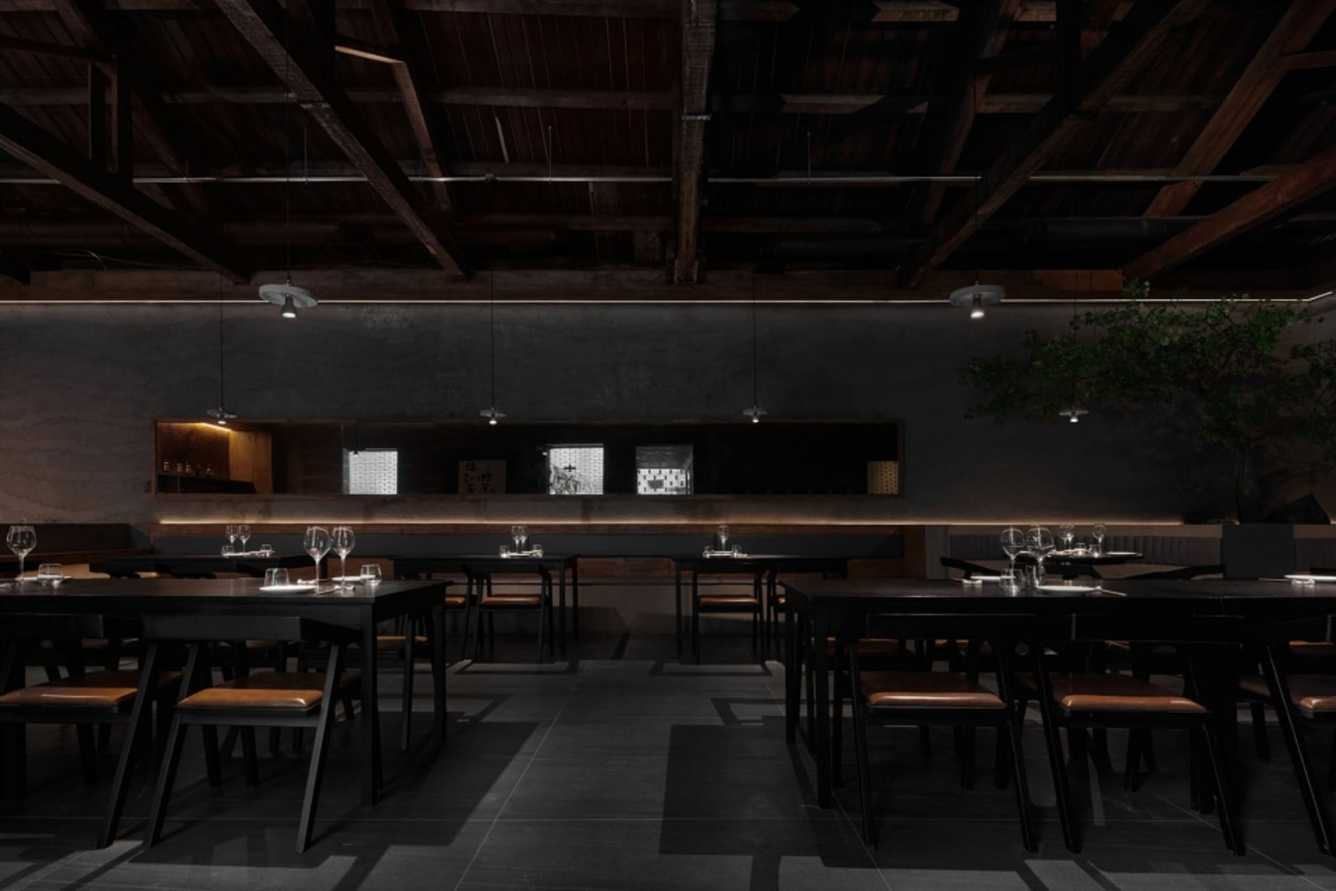 A modern restaurant with multiple dining tables and chairs, well-lit with a relaxed atmosphere