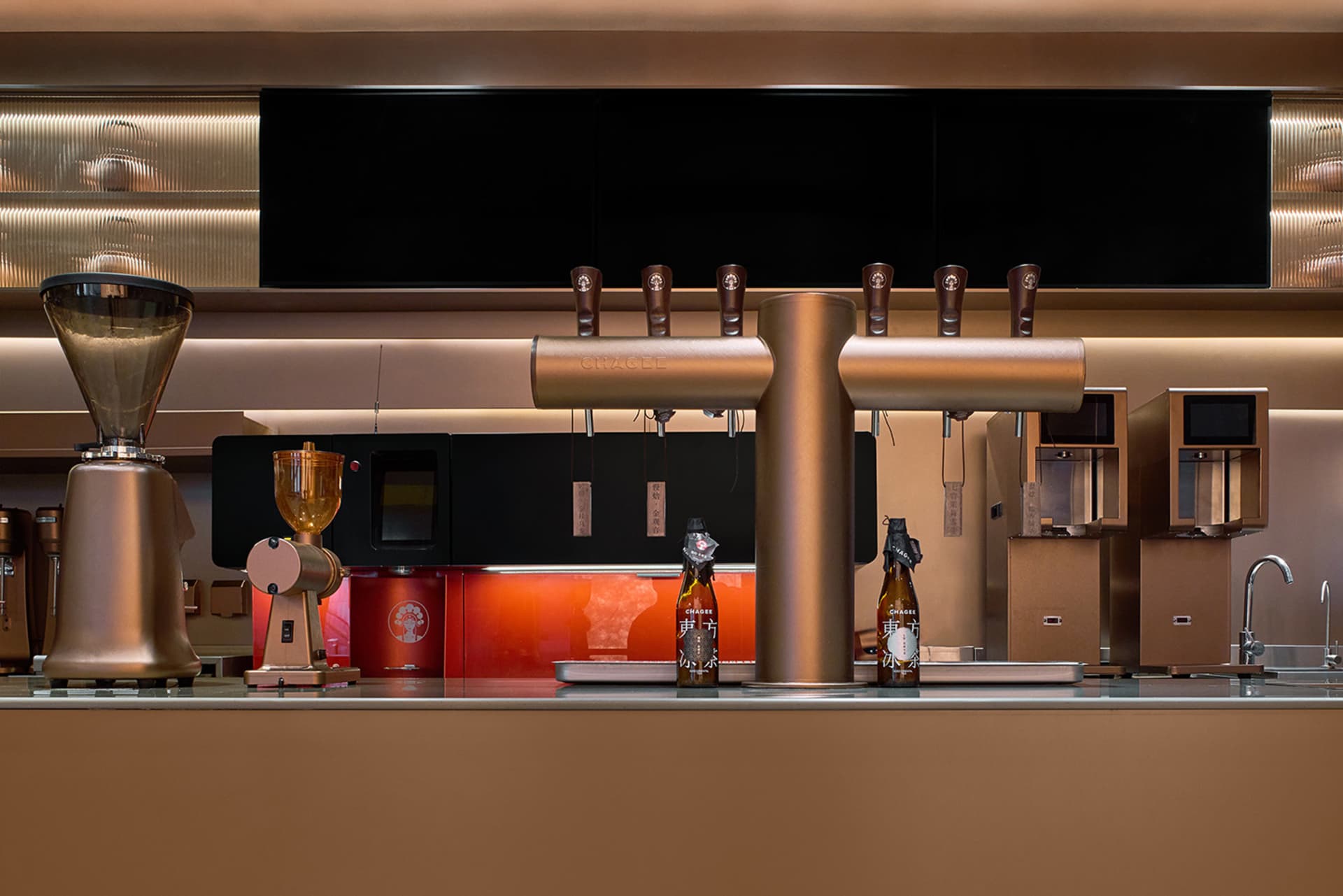 A modern bar with a countertop lined with a dozen beer bottles, creating a welcoming atmosphere for patrons