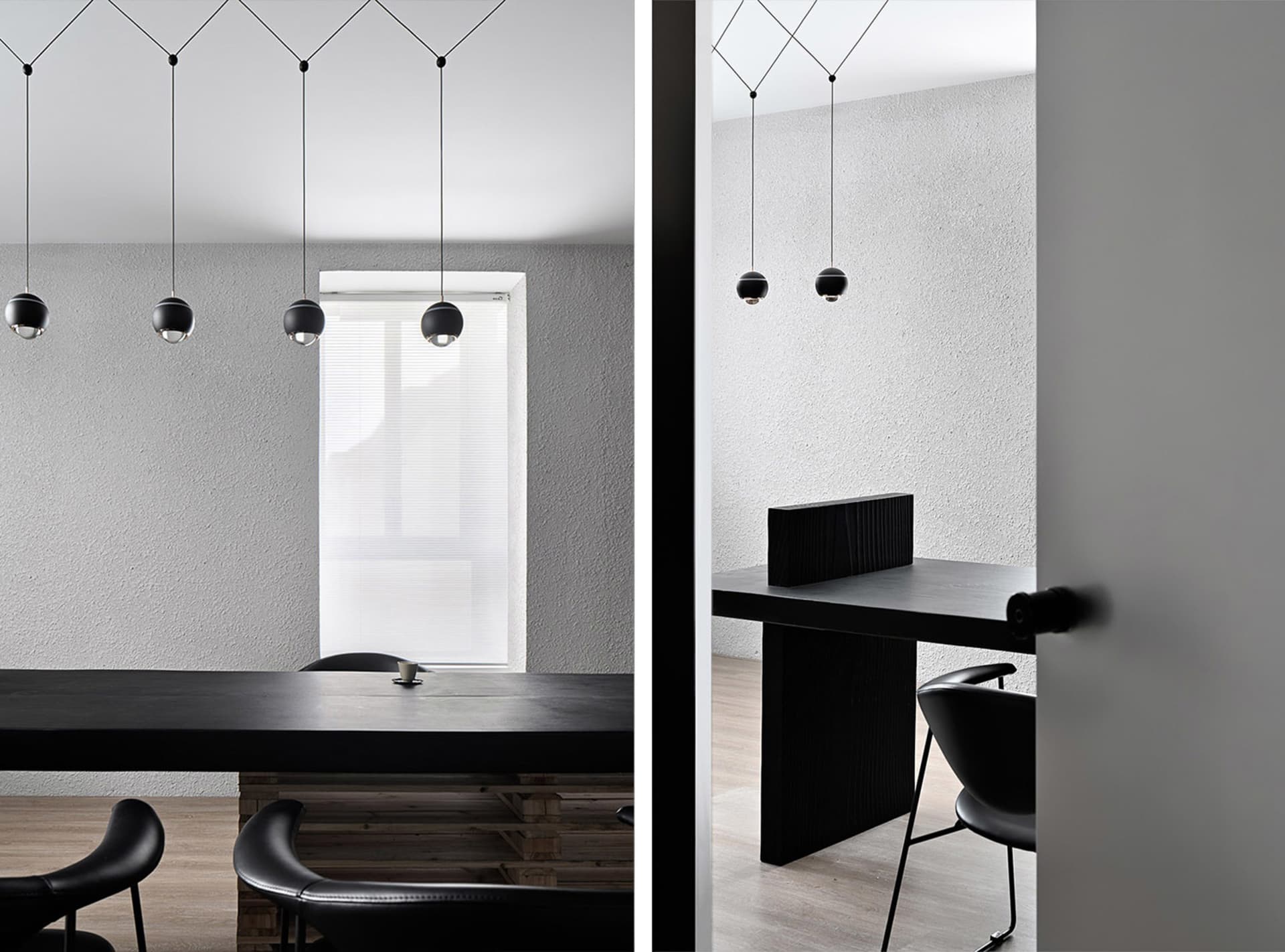 Modern office space with black chairs, a dining table, and a desk near a window, featuring clean lines and minimalistic elements, well-lit with natural light