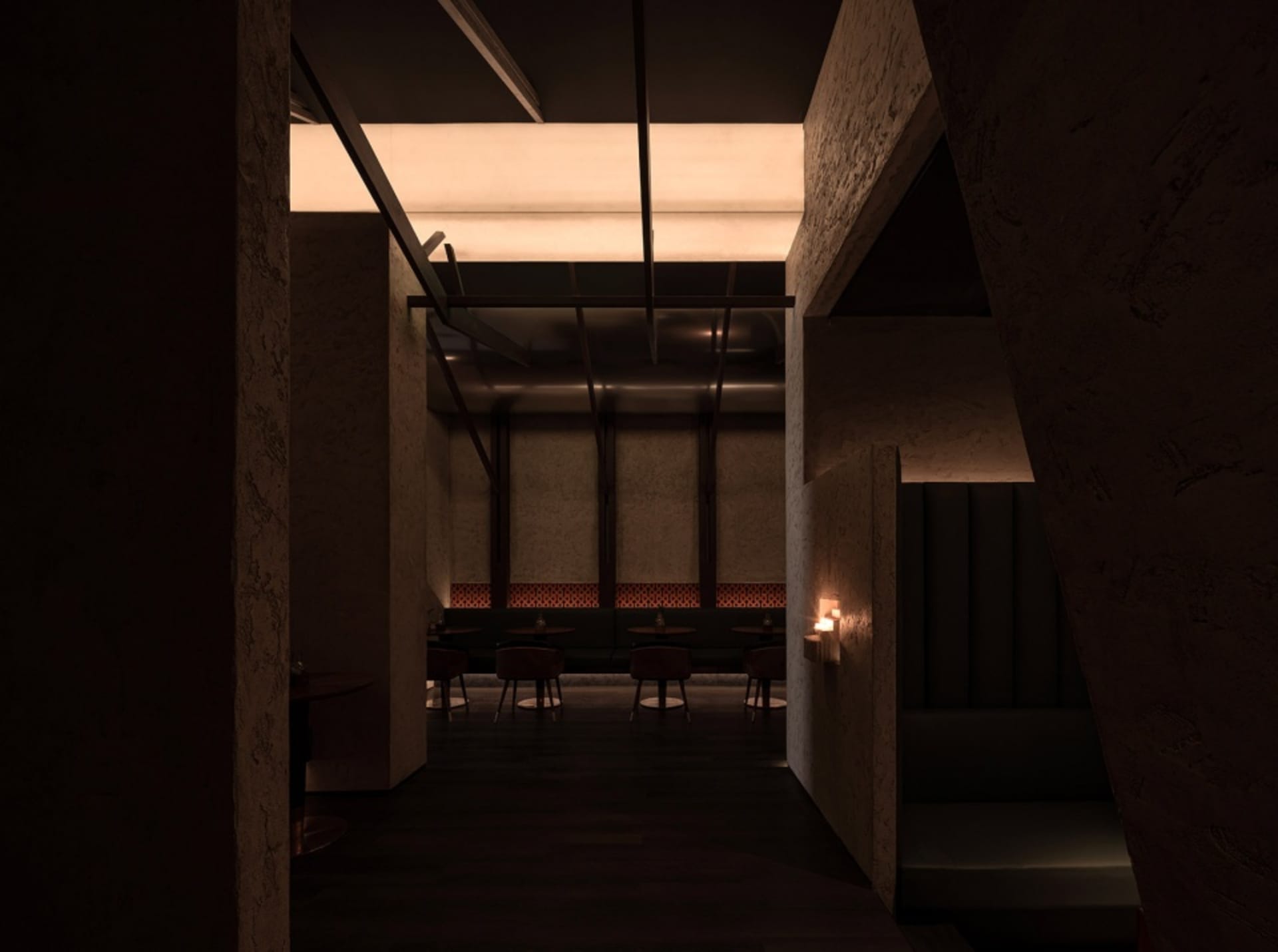 A modern restaurant with wood paneling, multiple tables, chairs, and couches, creating a warm and inviting atmosphere