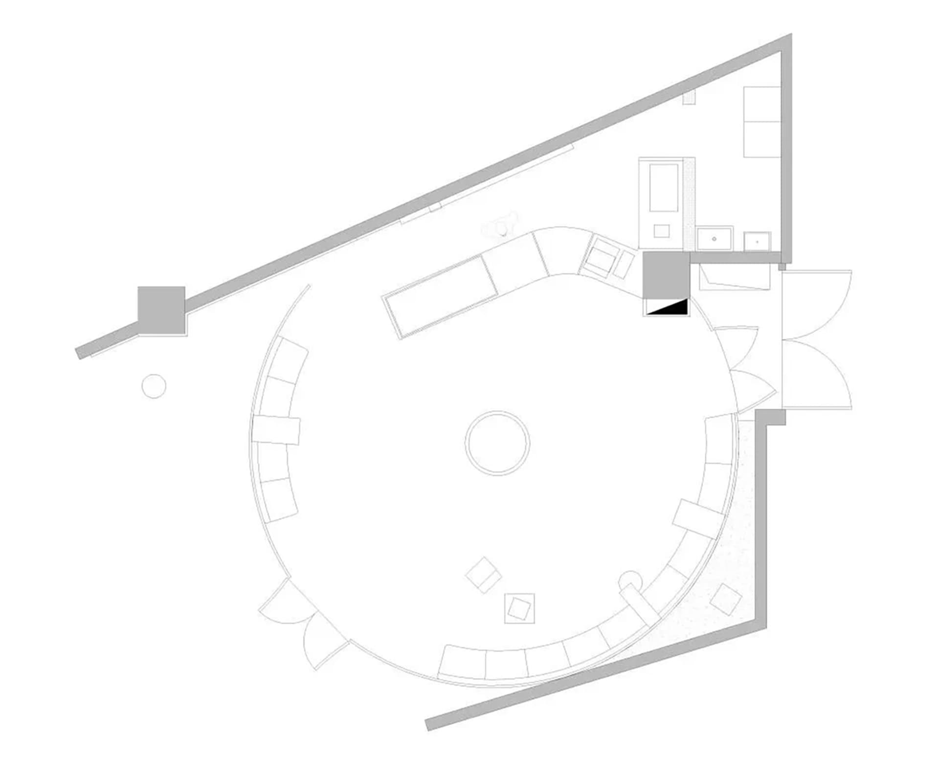 A clean and minimalist architectural drawing of a house with a central circular area and smaller circles representing windows or architectural elements