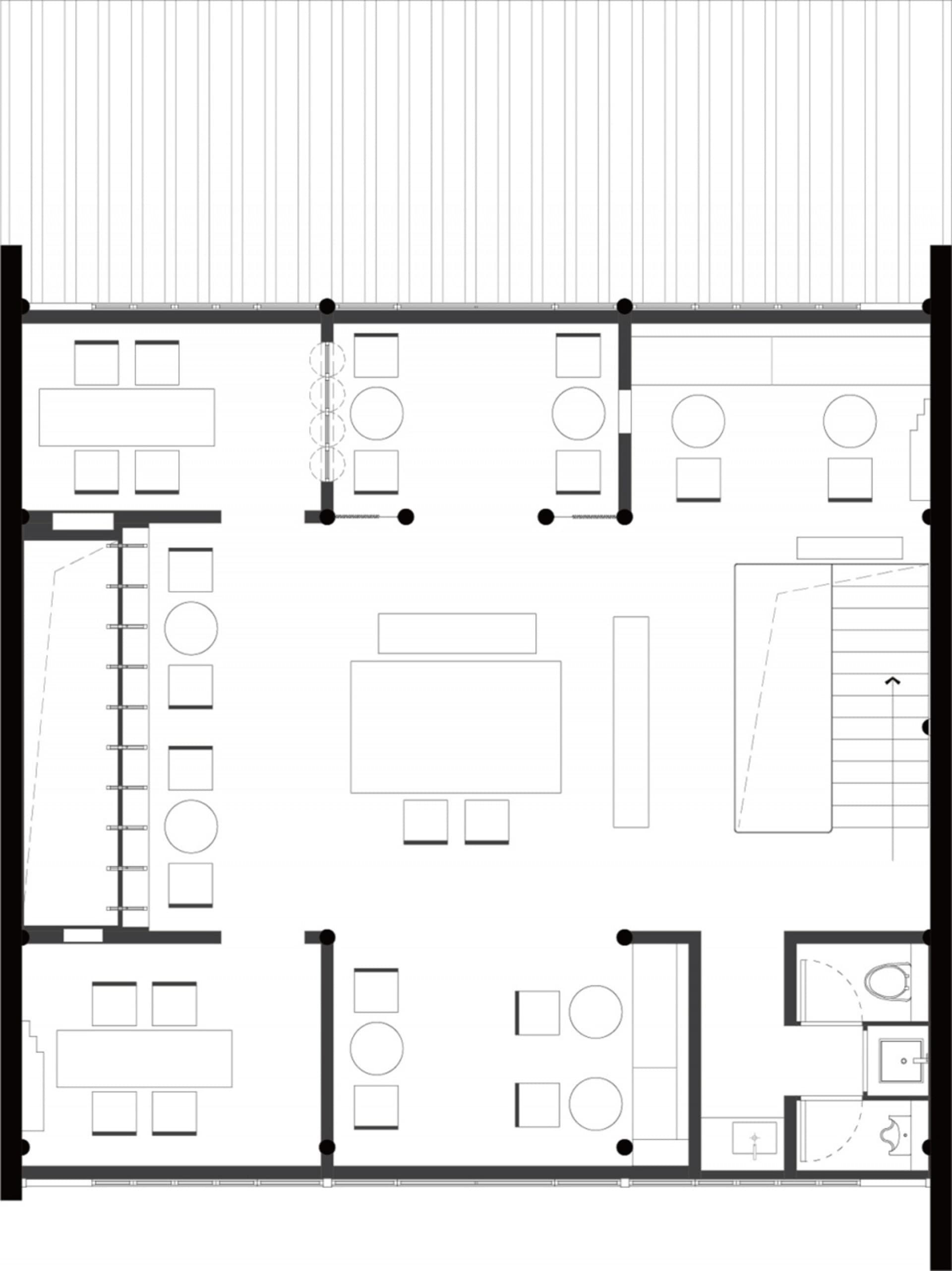 A clean and minimalist office space with white walls, a simple layout, and no furniture or decorations