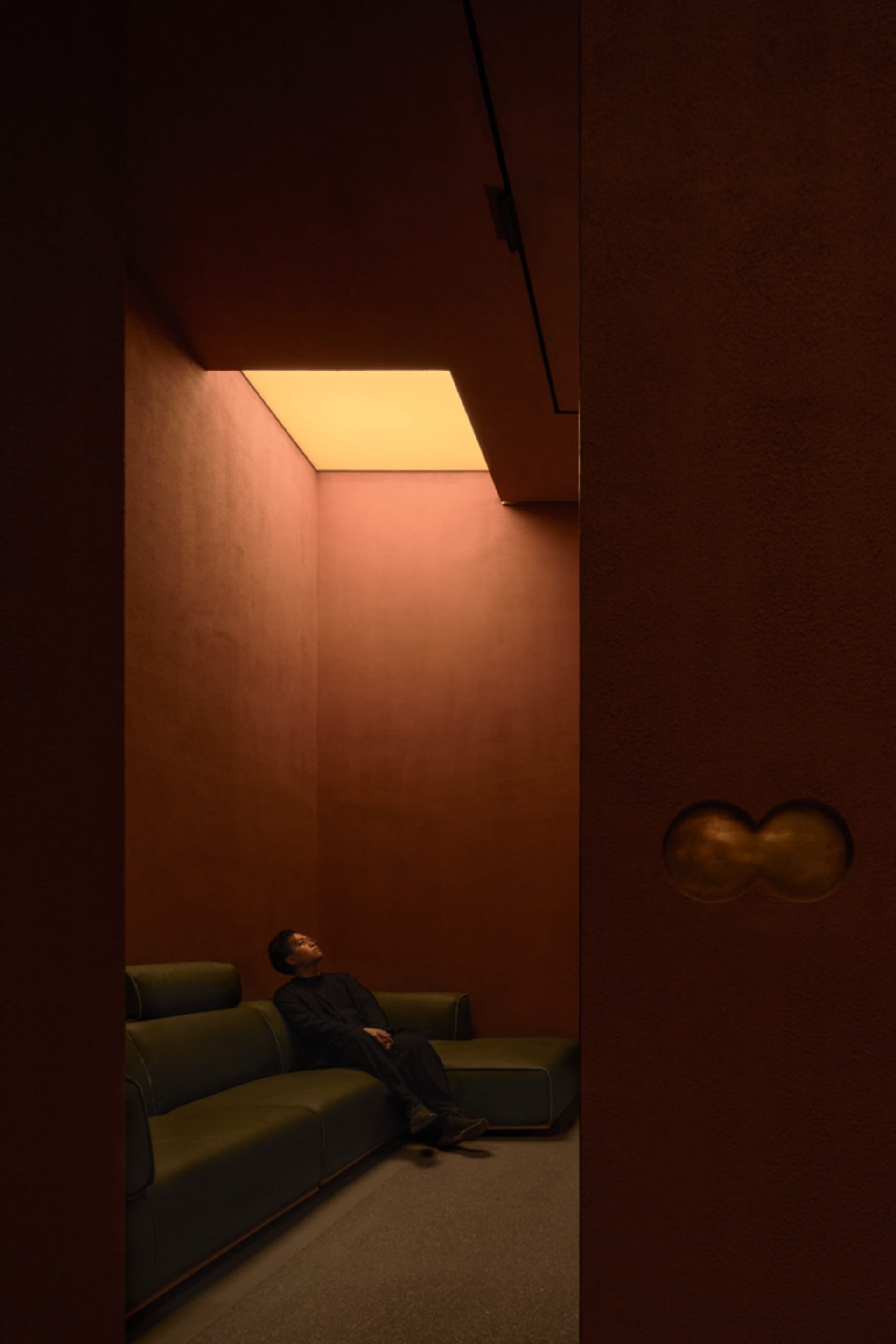 A cozy living area with a couch, two chairs, and a comfortable atmosphere