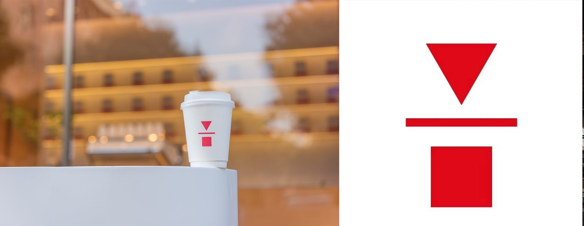 A white coffee cup sits on a table in front of a window, illuminated by natural light, in a bright indoor space