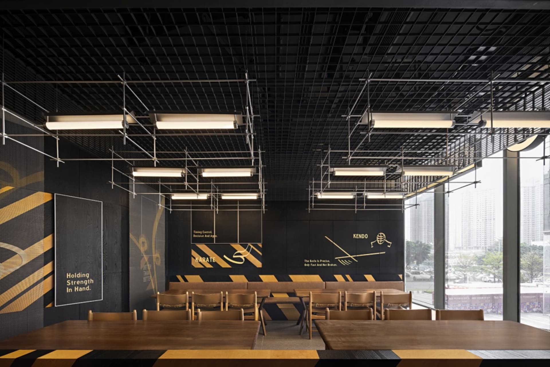 A modern restaurant dining area with multiple tables and chairs, creating a cozy atmosphere for guests
