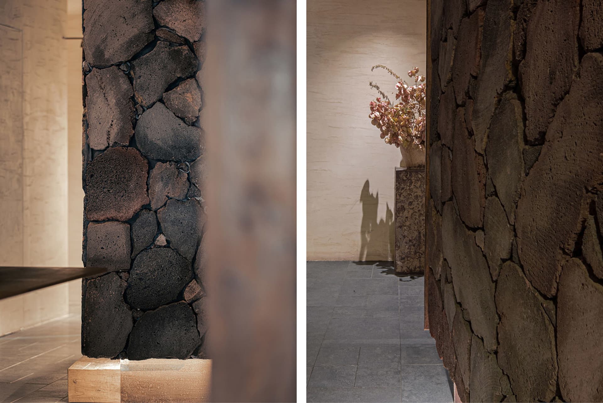 Interior space with stone walls, a vase, and a potted plant, featuring natural elements and a unique atmosphere