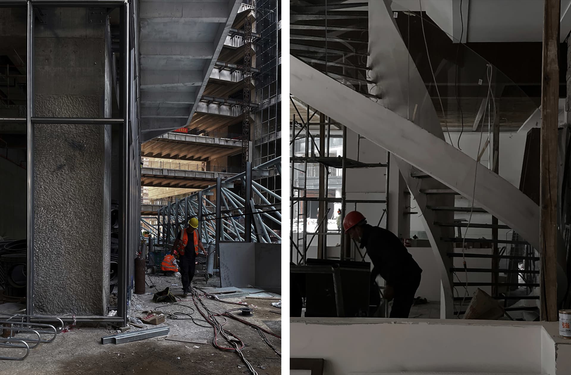 Construction workers on the ground level of an underground building, with a staircase leading down to multiple levels