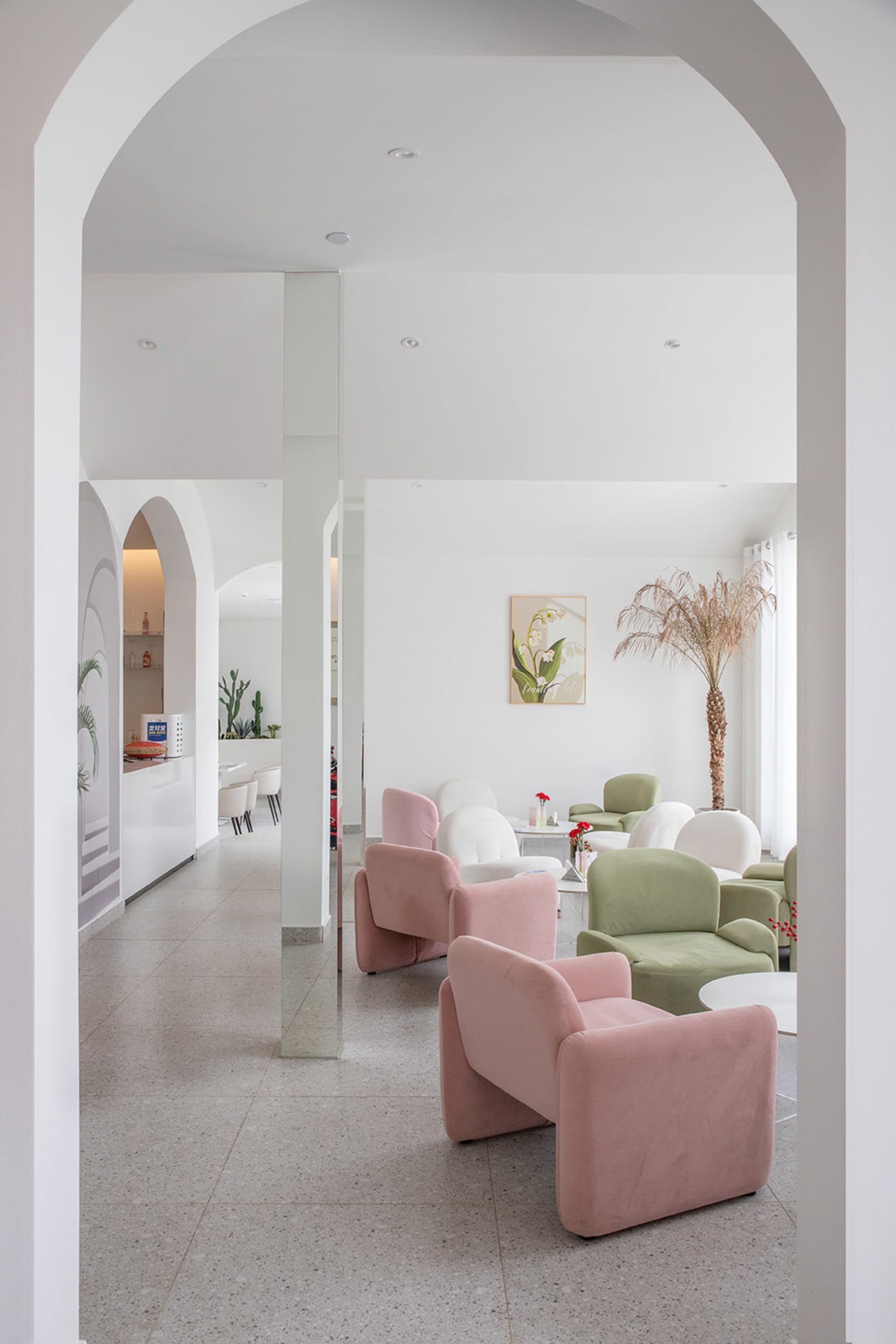 A showroom interior featuring multiple chairs and couches in a cozy, inviting atmosphere, with a focus on comfortable living space design