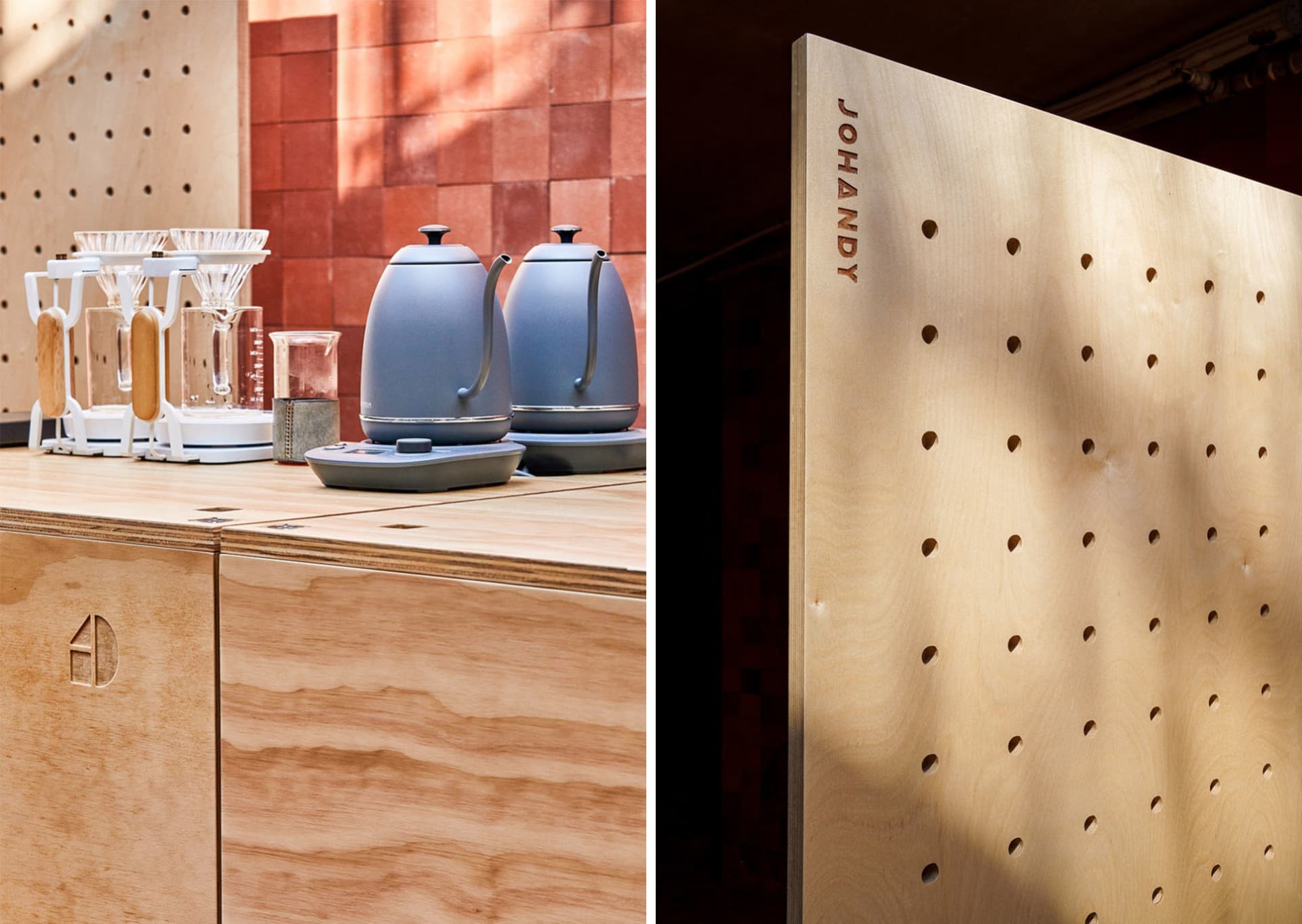 Modern kitchen design featuring wooden countertops, a coffee maker, and a decorative pegboard wall