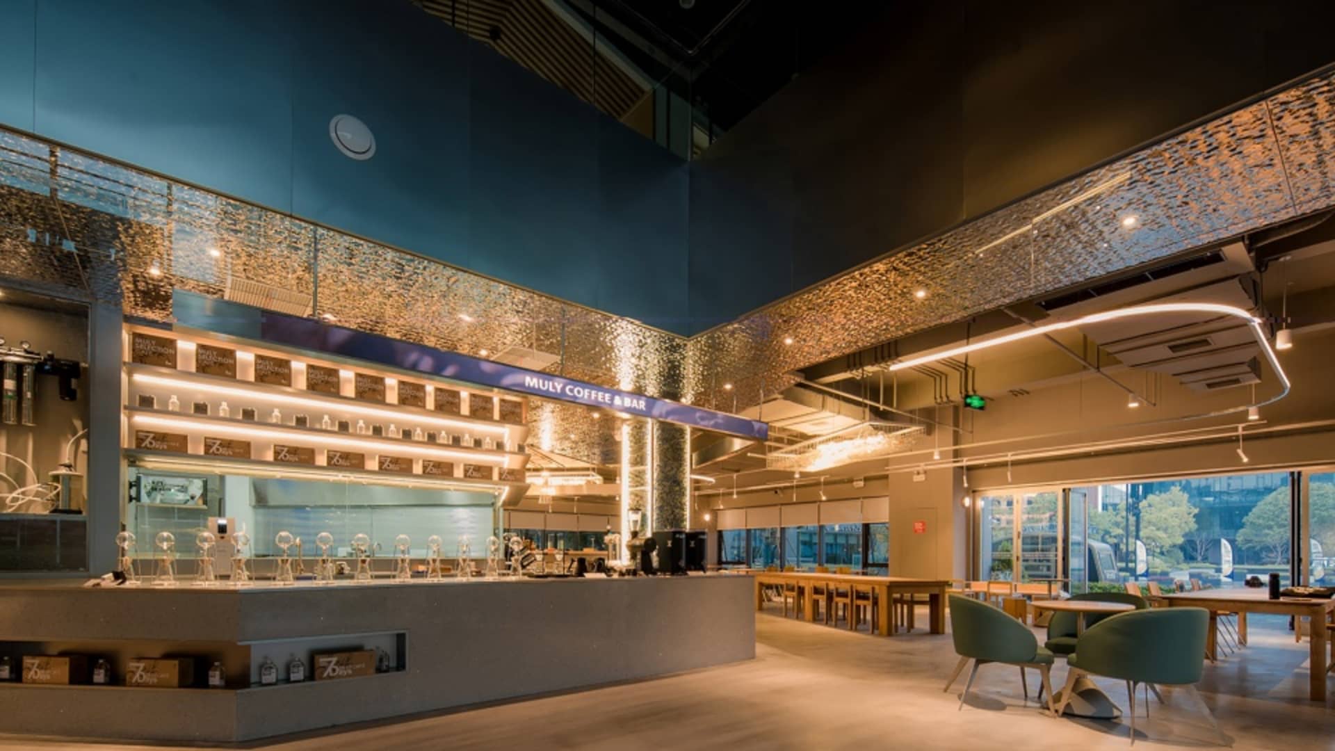 Inviting coffee shop interior with a modern bar, comfortable seating, and unique tile walls