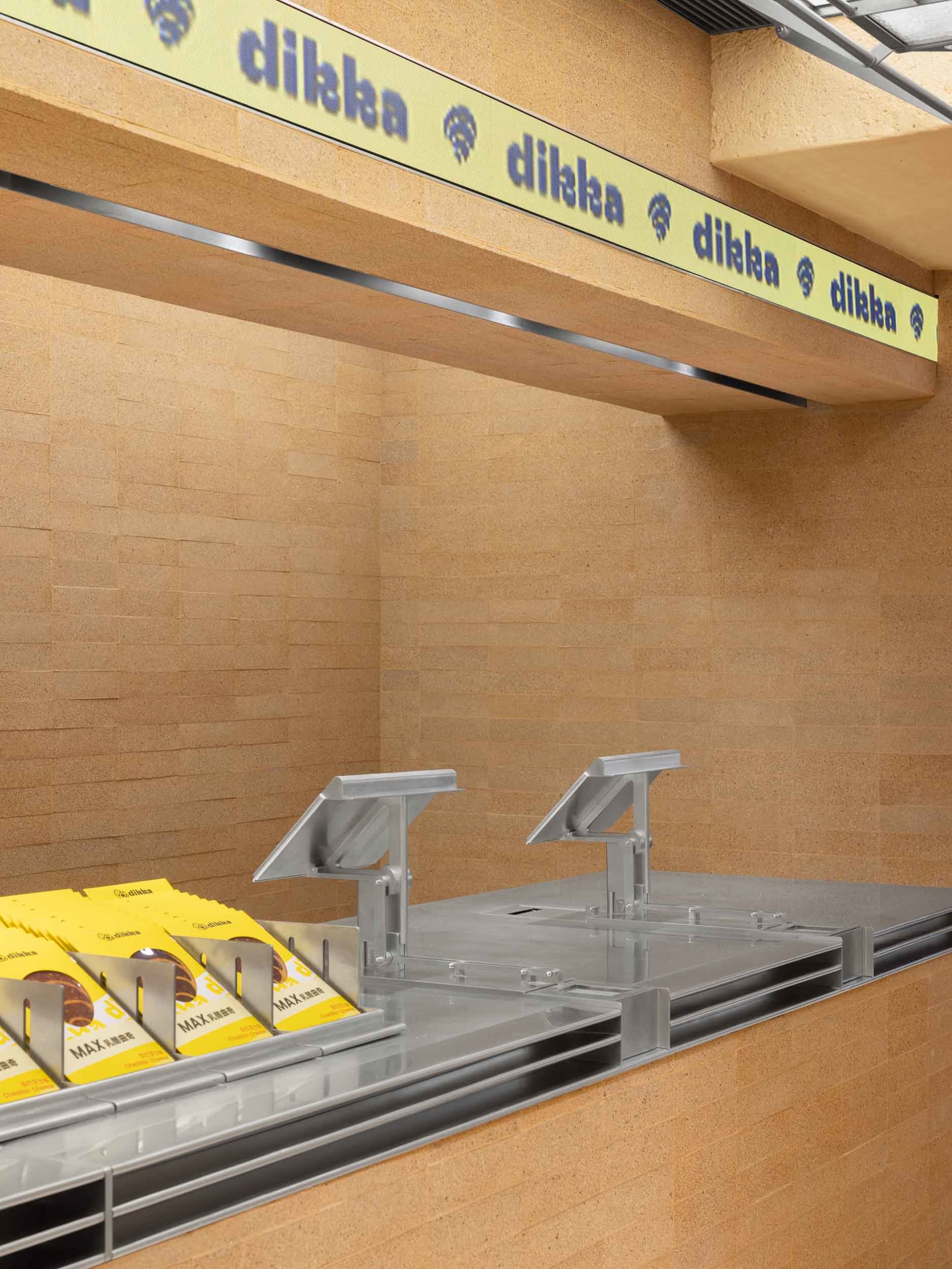 Inviting restaurant counter with display case containing cakes and sandwiches, ready for customers