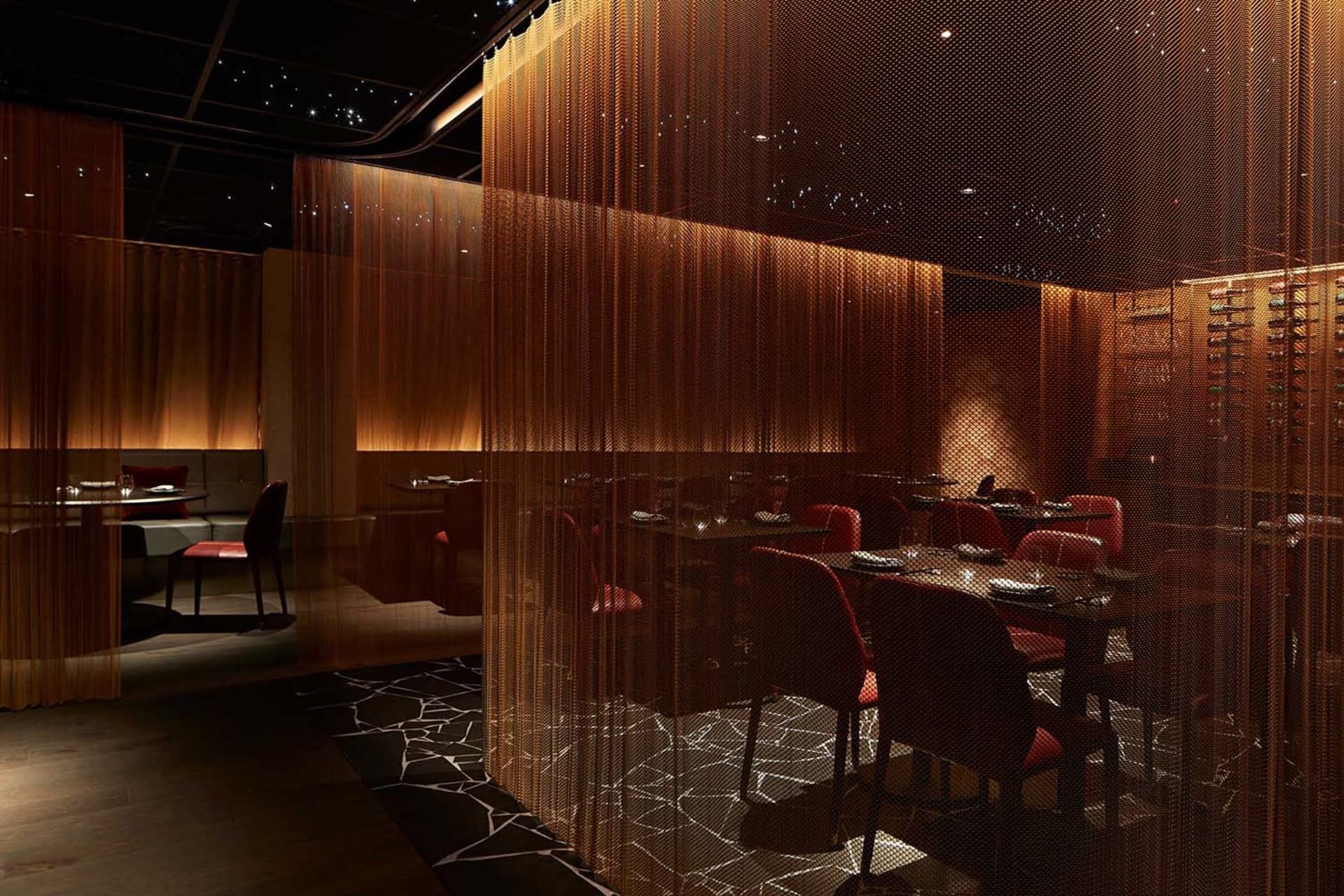 A modern restaurant with several tables and chairs, creating an inviting and comfortable atmosphere with a focus on functionality and contemporary aesthetics