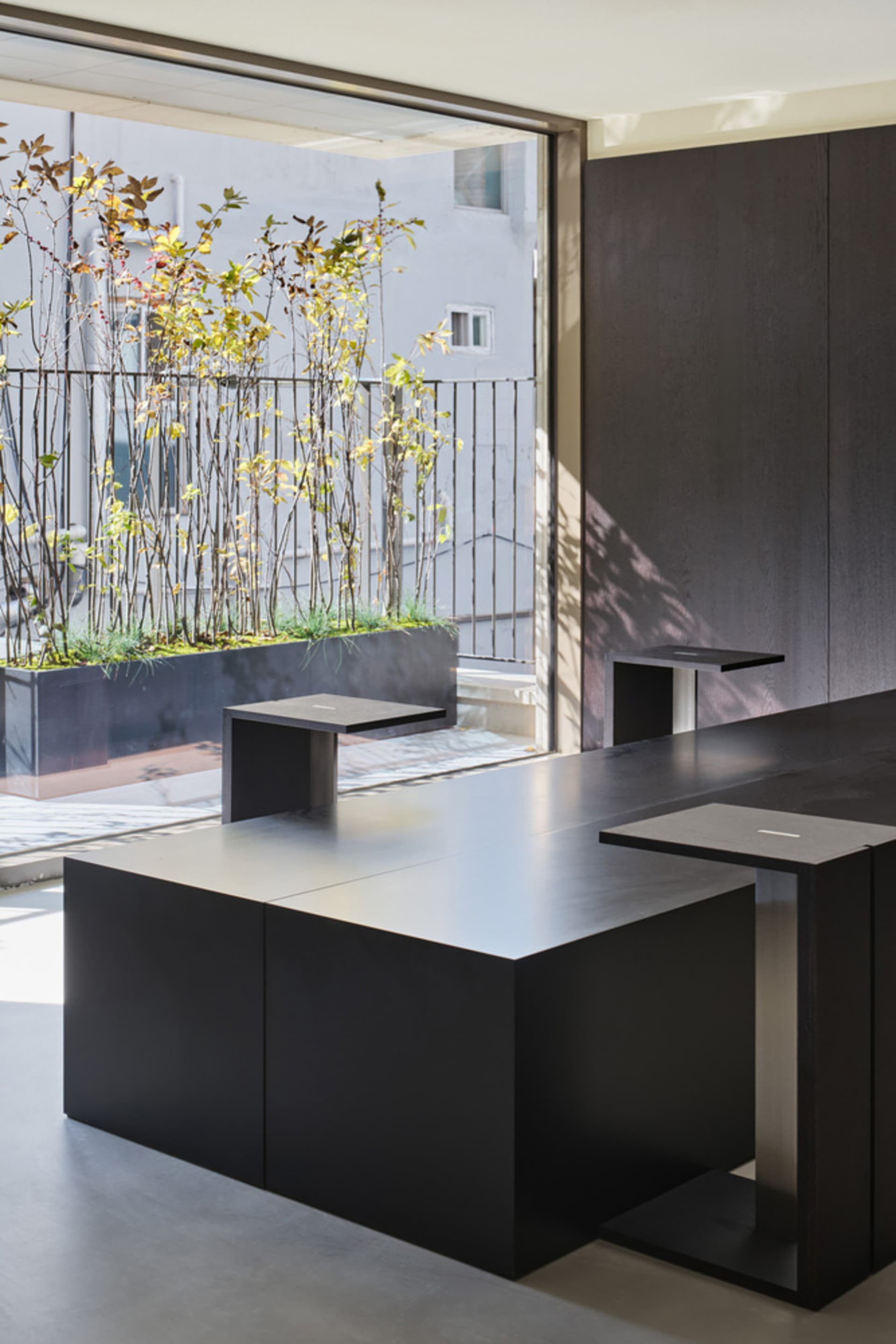 A cozy dining space with a metal table and chairs, surrounded by inviting atmosphere and comfortable seating