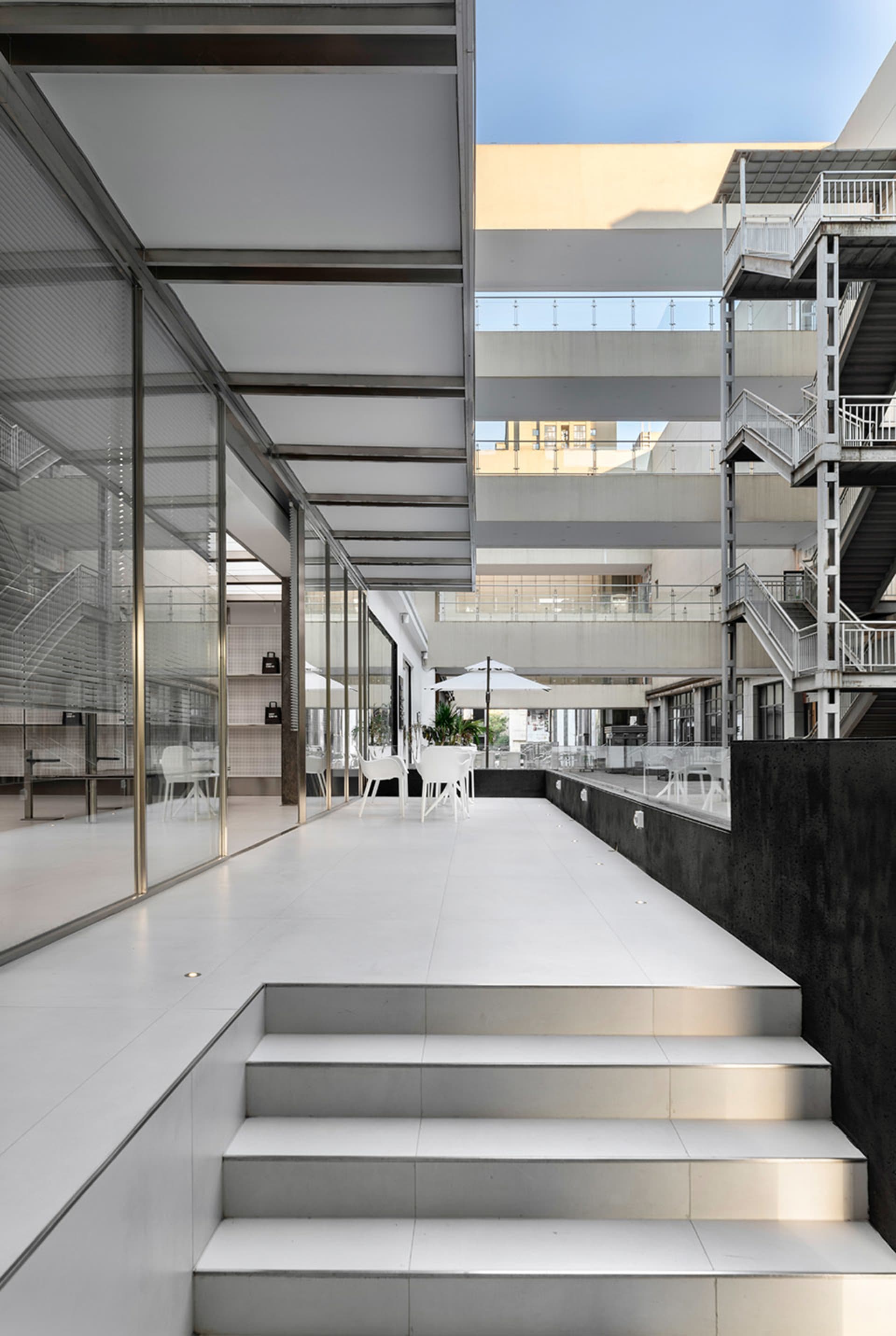 Modern Multi-Level Space with White Walls | Feel Design