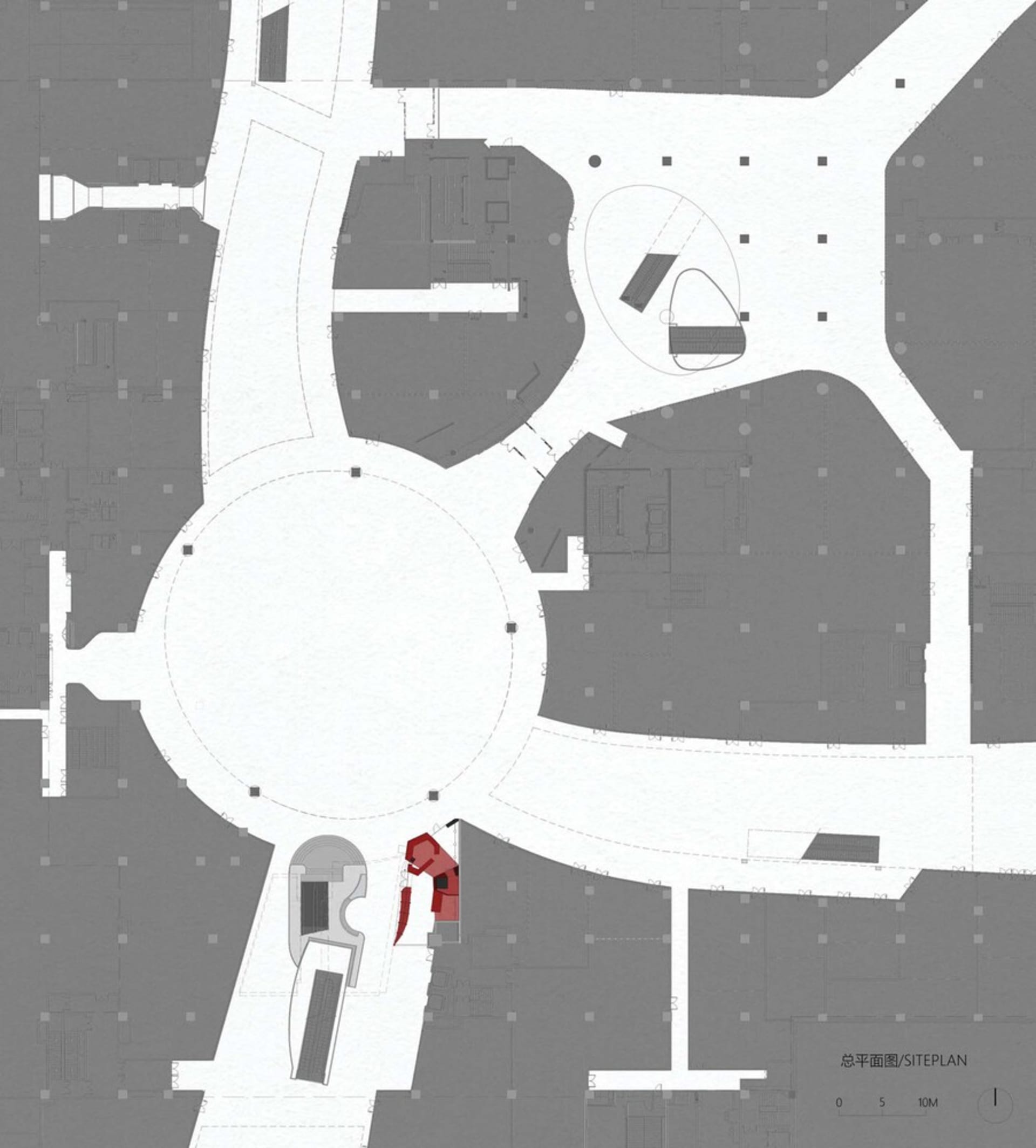 Architectural drawing of a modern building with a circular central area, surrounded by rooms, including a dining area and a kitchen, with a red object indicating a focal point