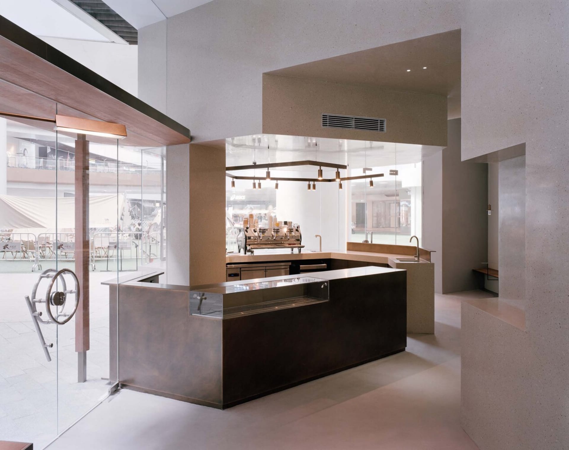 A well-equipped kitchen with a dining table, sink, and various appliances, set in a functional and organized space for cooking and meal preparation