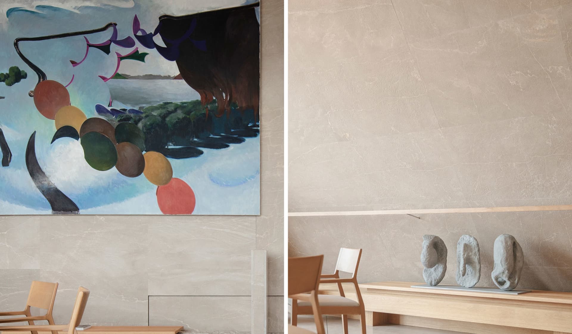 A modern living space with a large painting on the wall, two chairs, and a dining table, featuring a combination of wood and stone elements