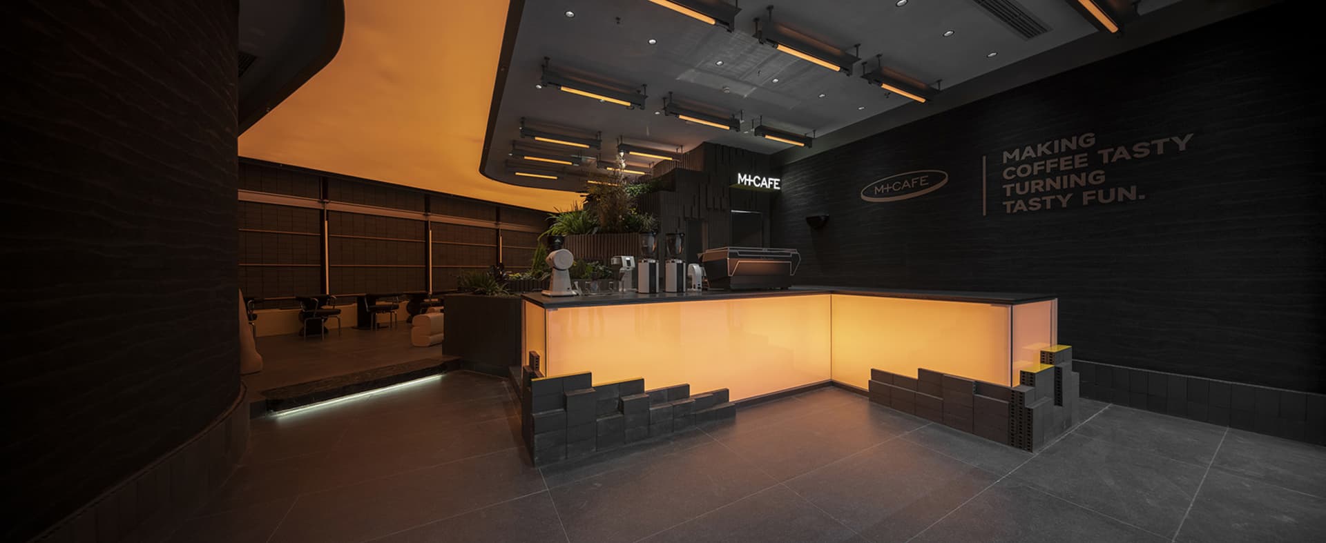 A modern cafe interior with a counter, chairs, and scattered cups and bottles, creating an inviting and comfortable atmosphere