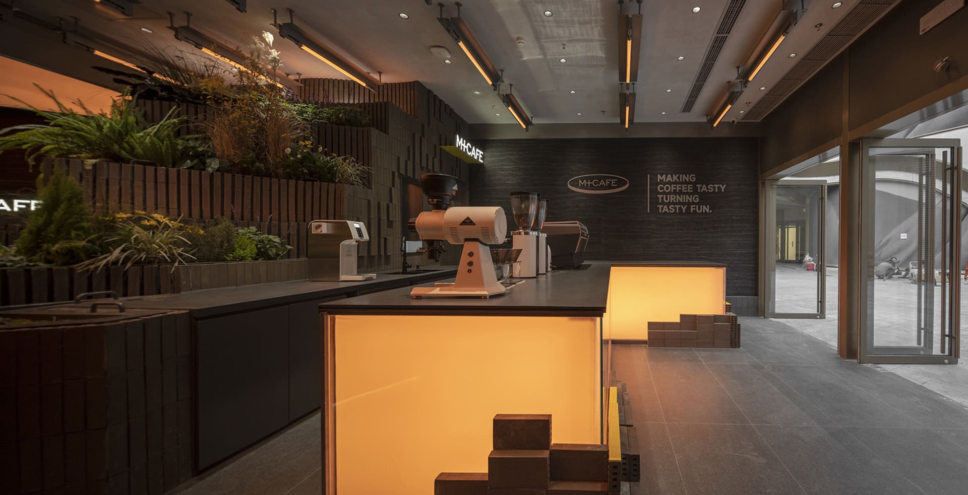 Bright and inviting cafe interior with modern appliances, natural light, and sleek lines