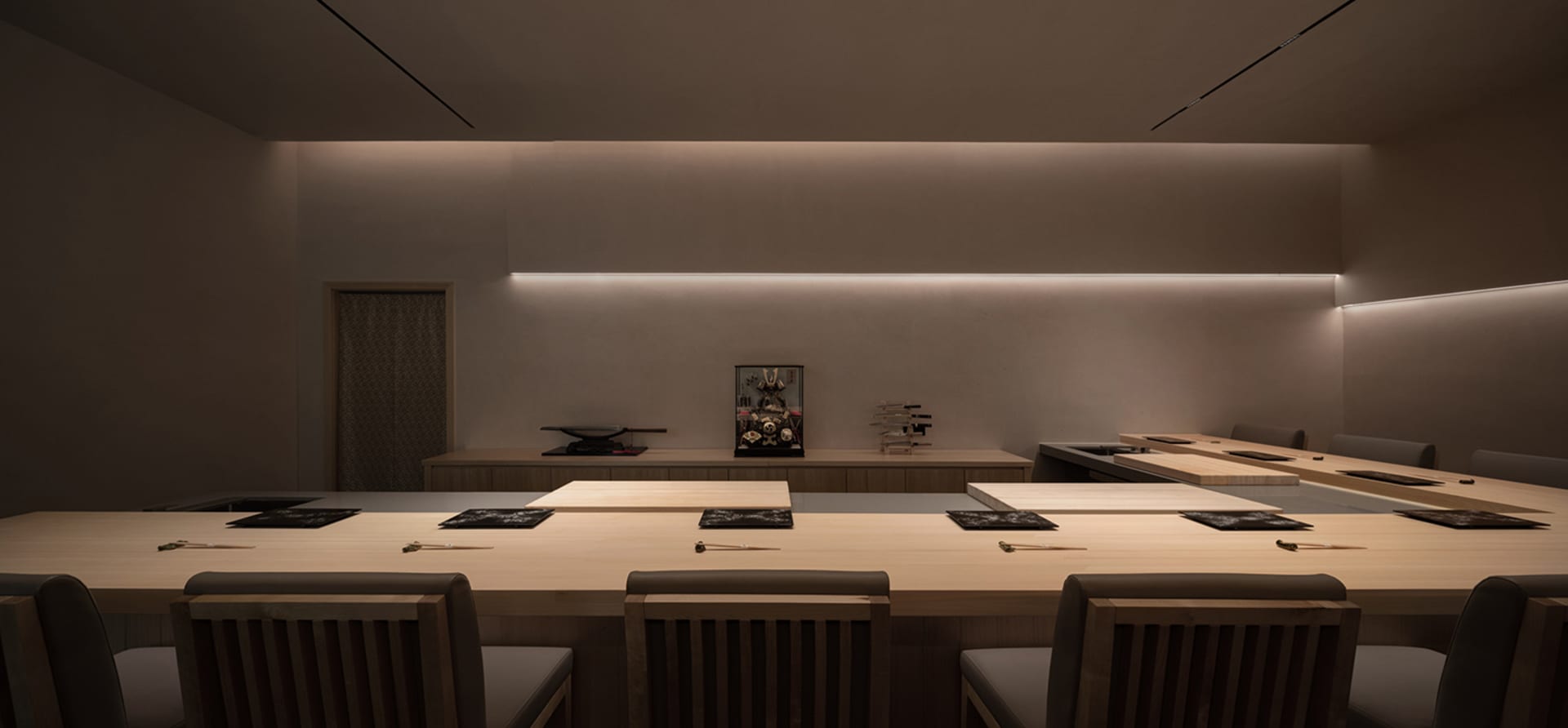Empty restaurant dining area with wooden tables and chairs, clean and well-organized, ready for customers