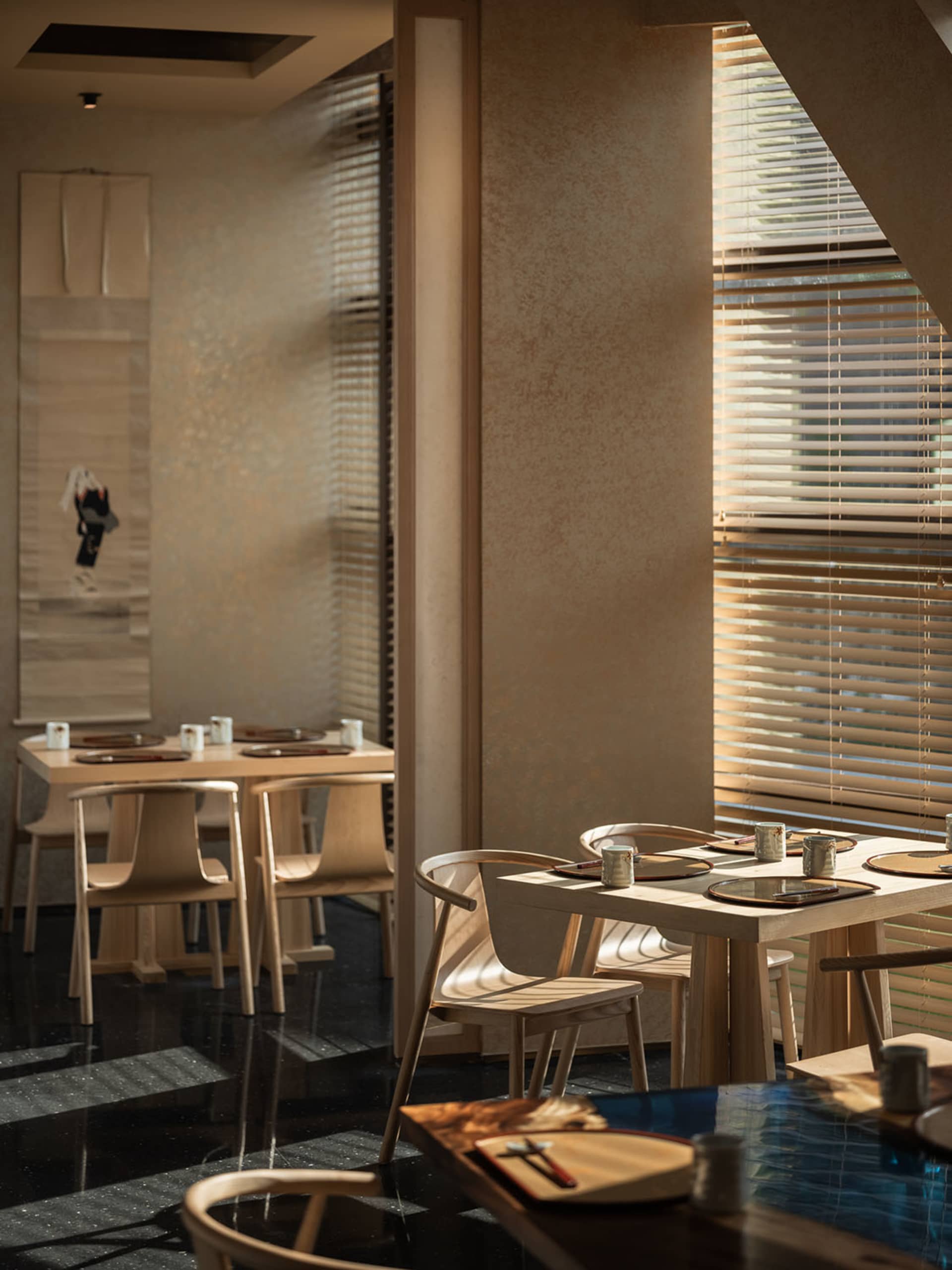 Empty restaurant dining area with multiple tables and chairs, clean and inviting atmosphere