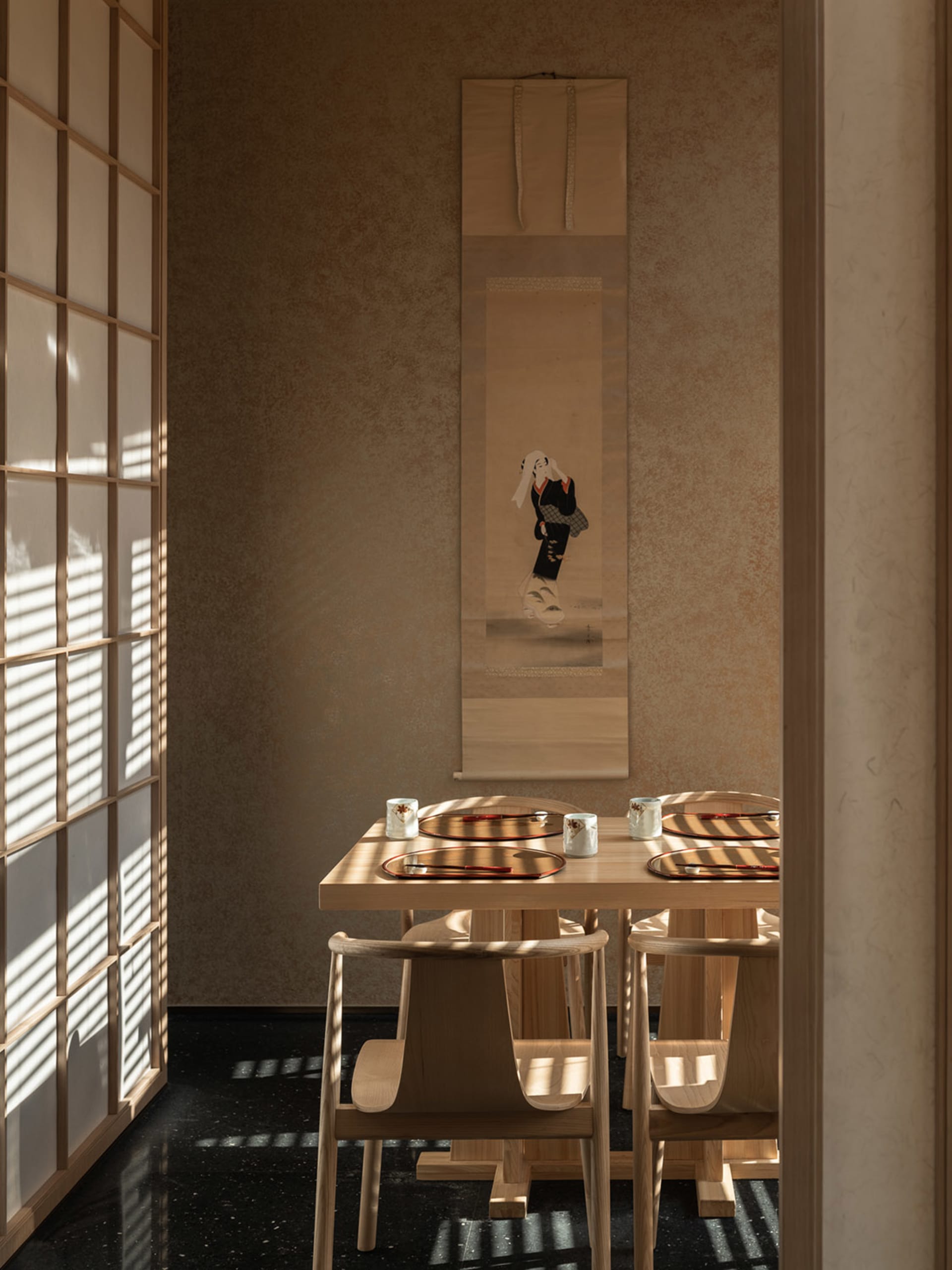 A dining area with a wooden table and chairs, set with cups, in a calm and inviting atmosphere