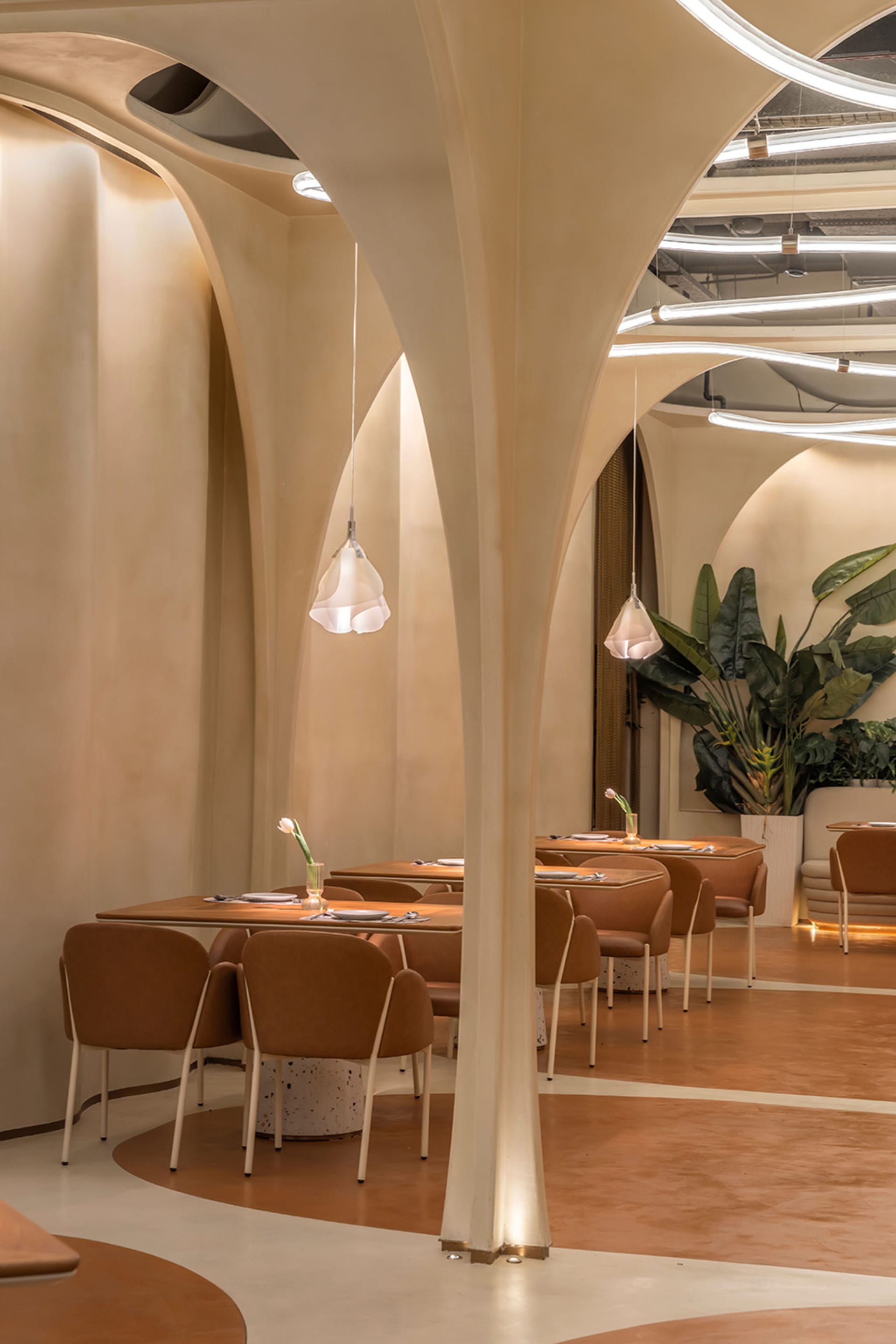 Empty restaurant with dining tables and chairs, clean and inviting atmosphere